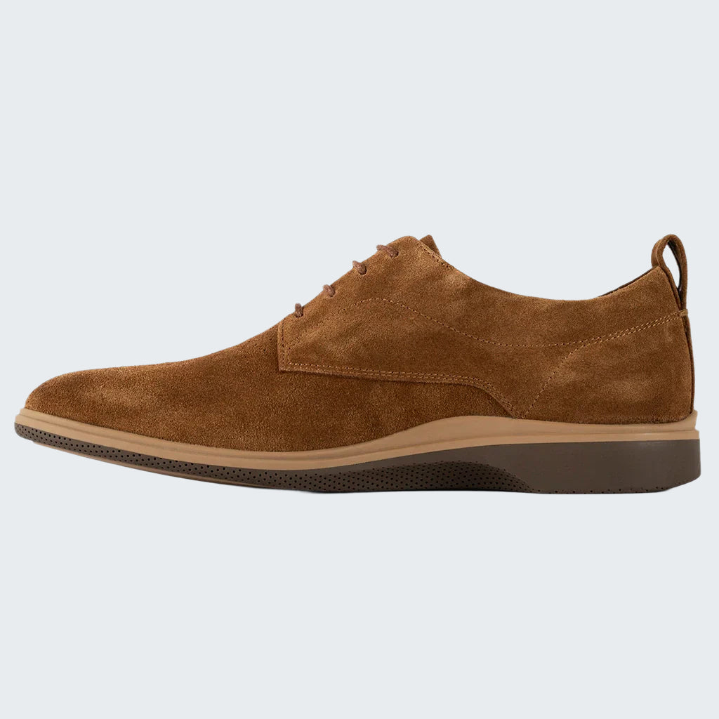 Brown suede shoe on a white background