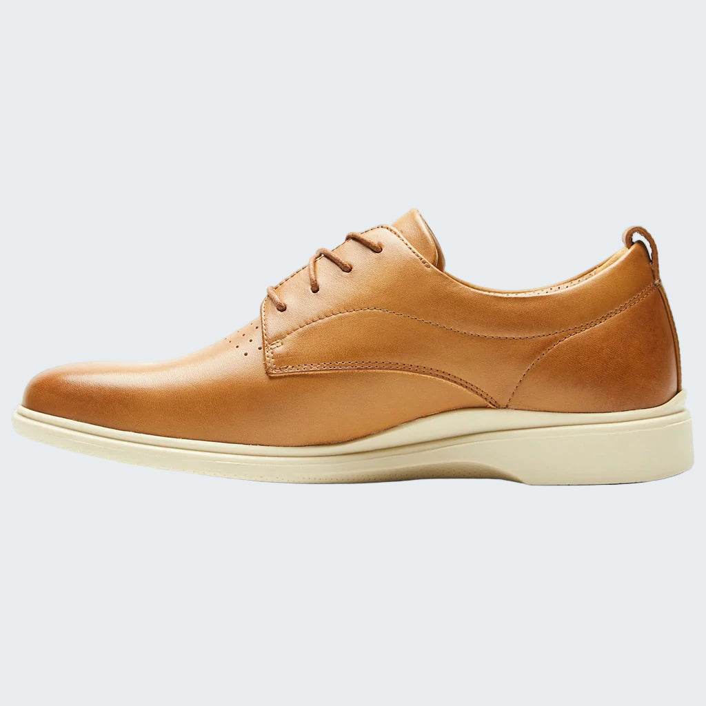 Tan leather shoe on a white background