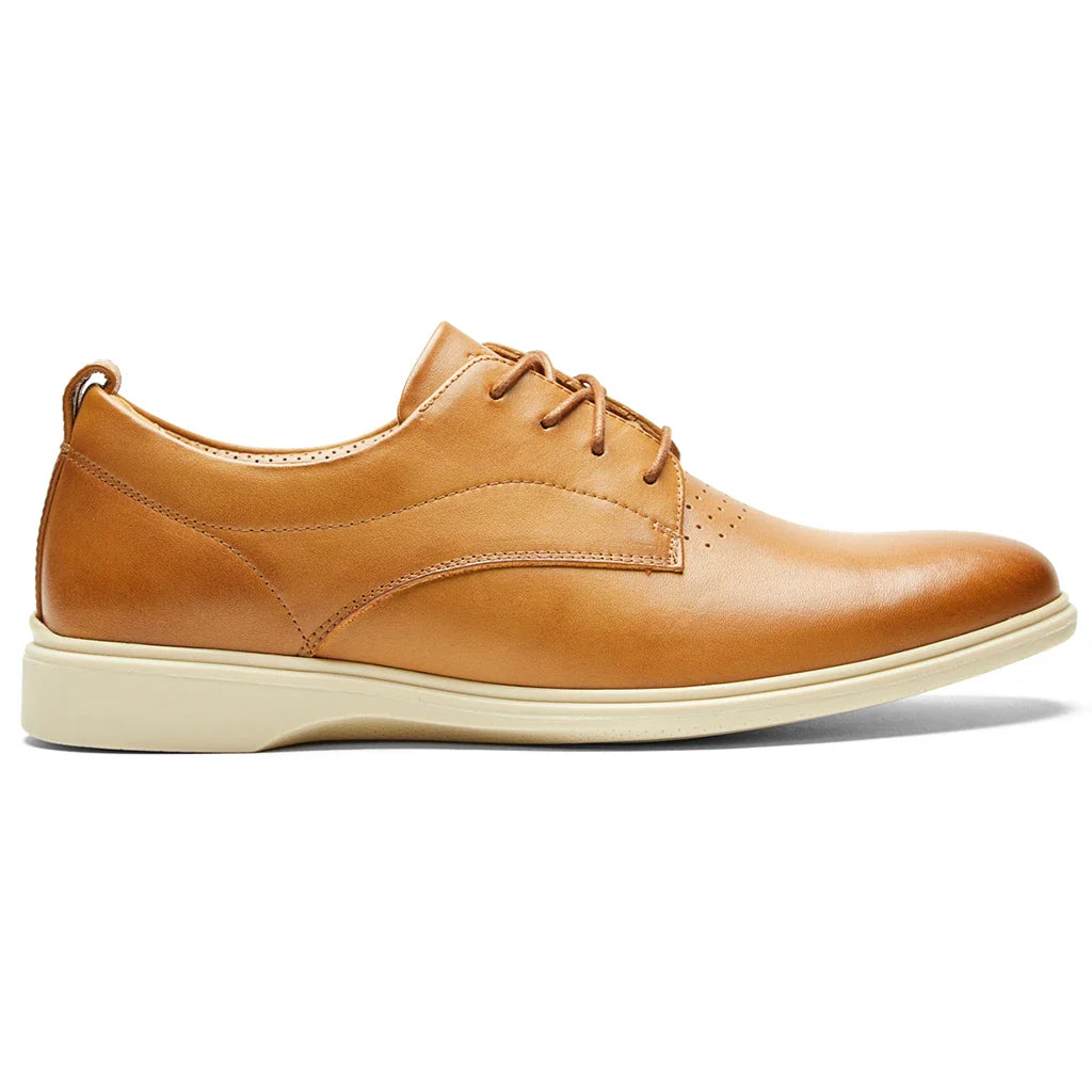 Tan leather shoe on a white background