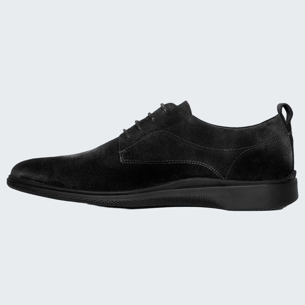 Black suede shoe on a white background