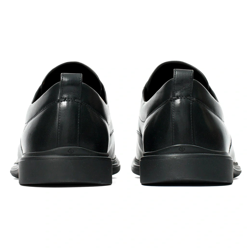Black leather shoes shown from the back on a white background