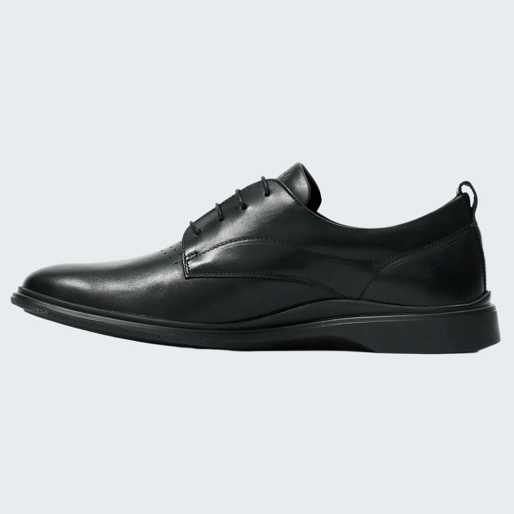 Black leather dress shoe on a white background