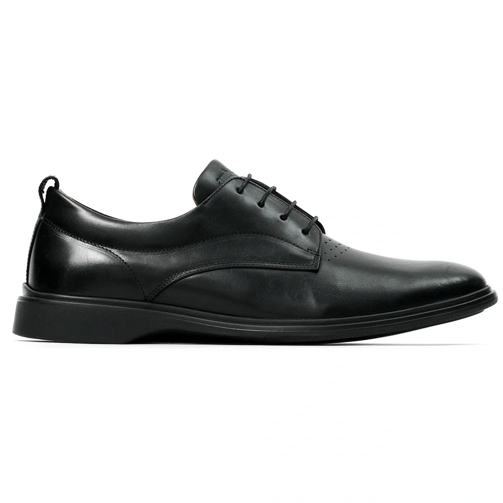 Black leather dress shoe on a white background