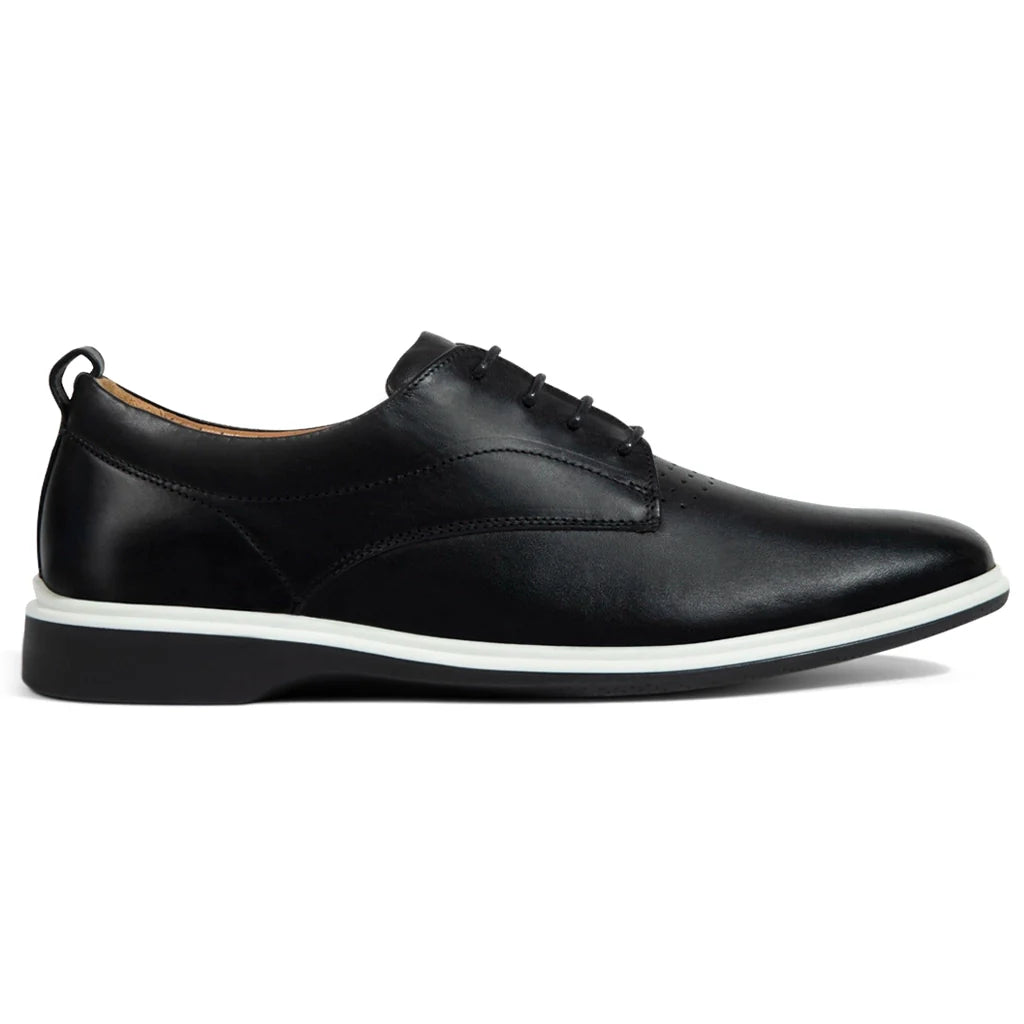 Black leather shoe with white sole on a white background