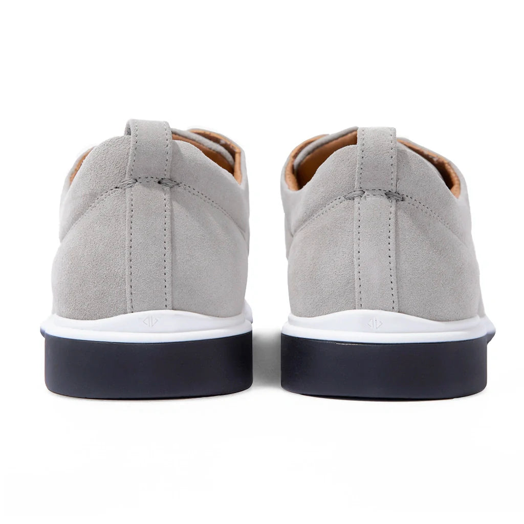 Gray sneakers with white soles on a white background