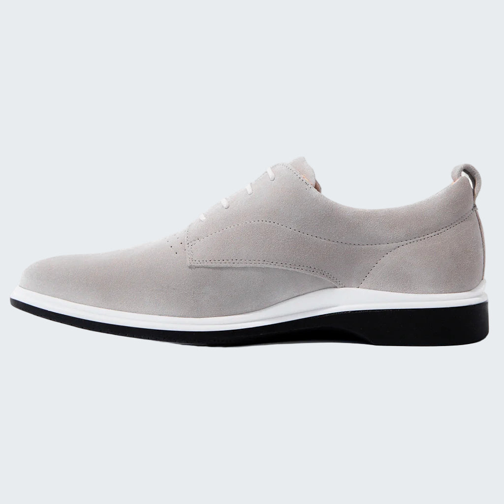 Gray shoe with a white sole on a white background