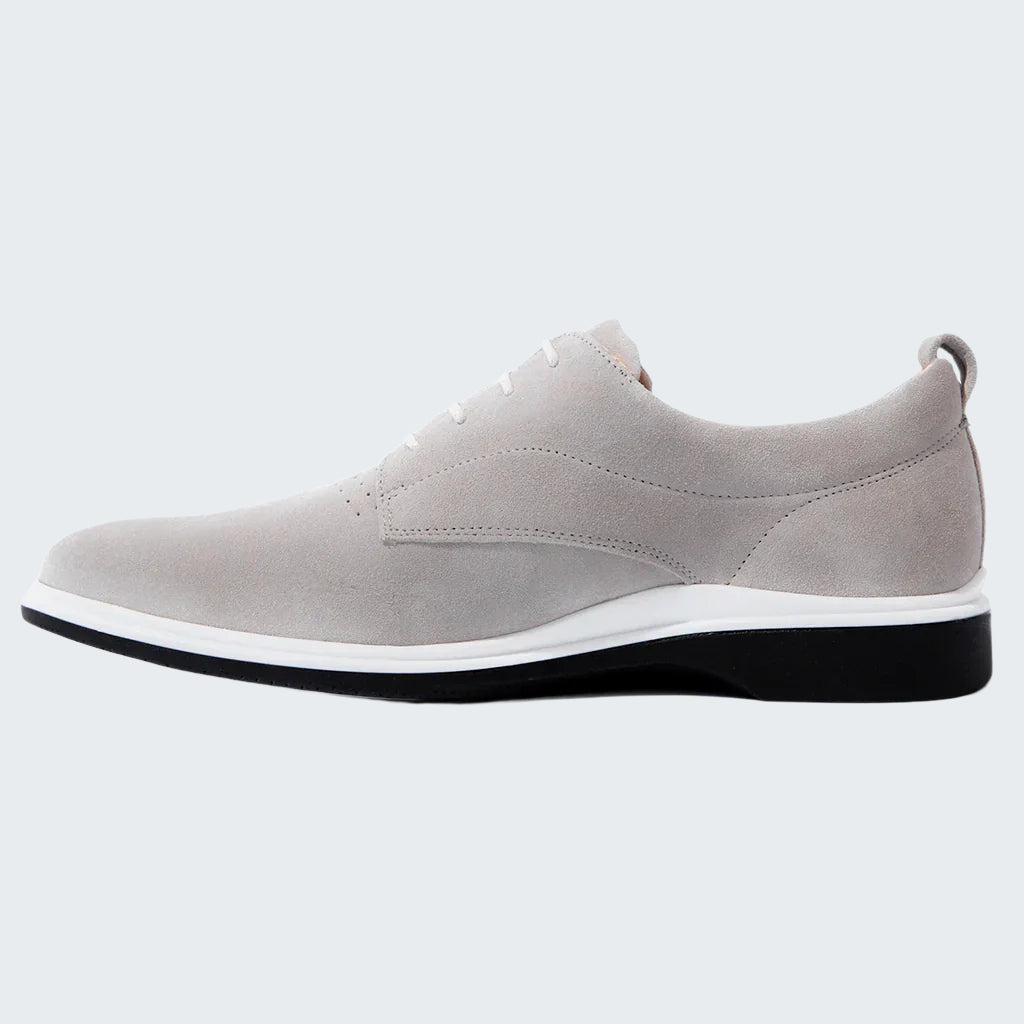 Gray shoe with a white sole on a white background