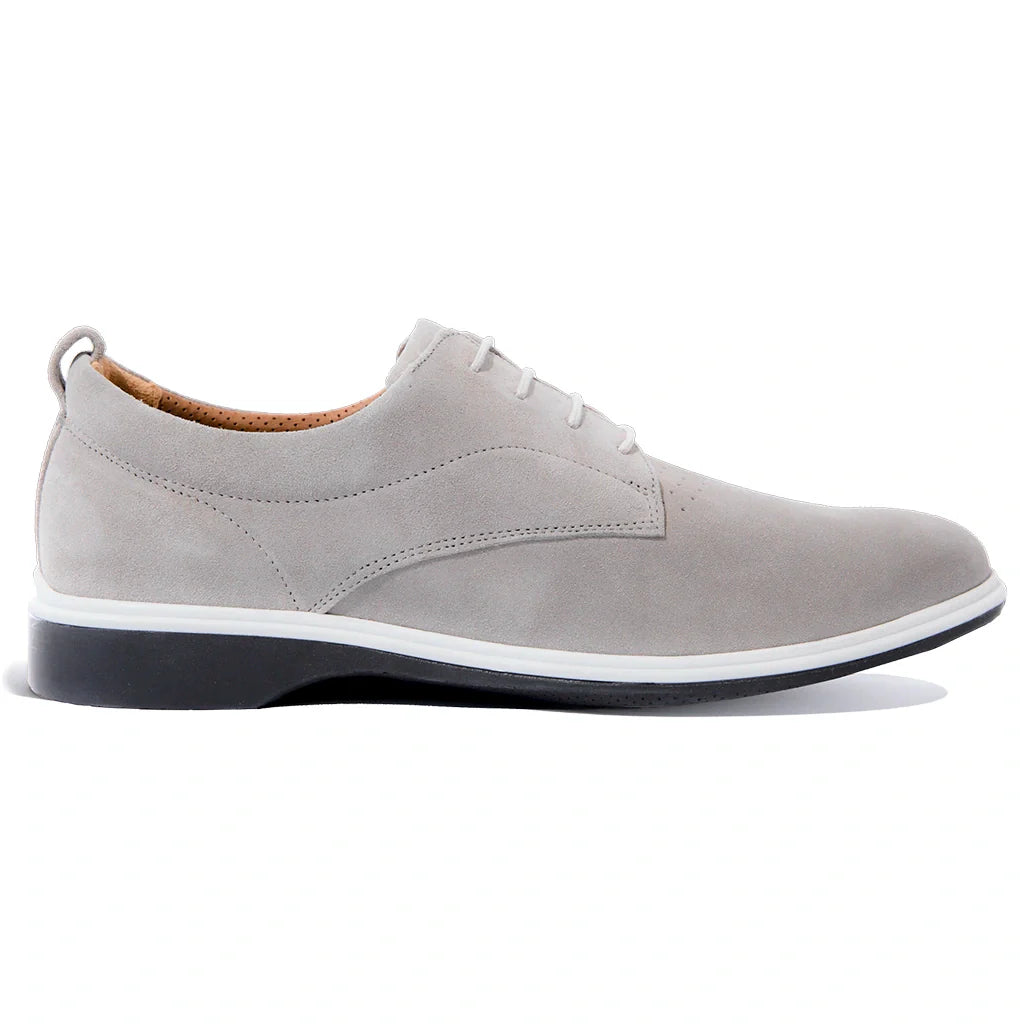 Gray suede shoe with a white sole on a white background