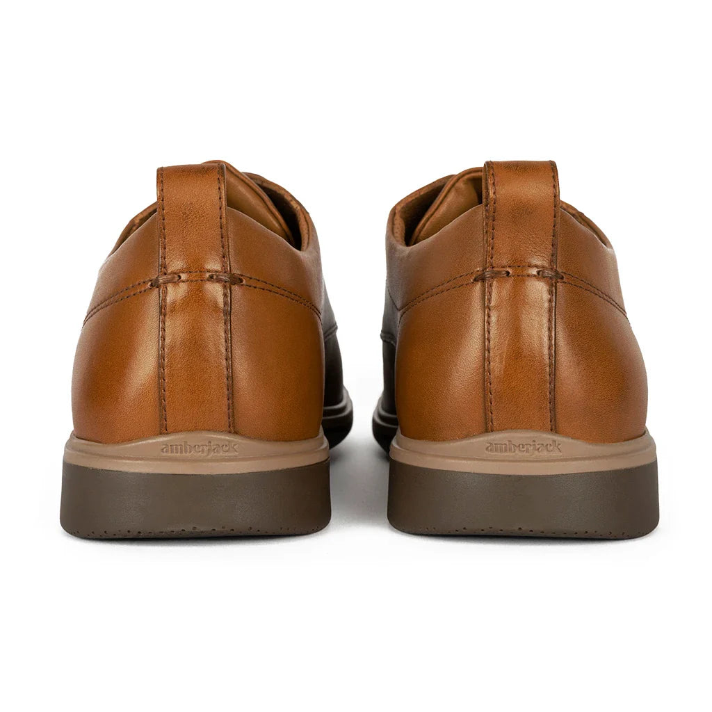 Pair of brown leather shoes on a white background