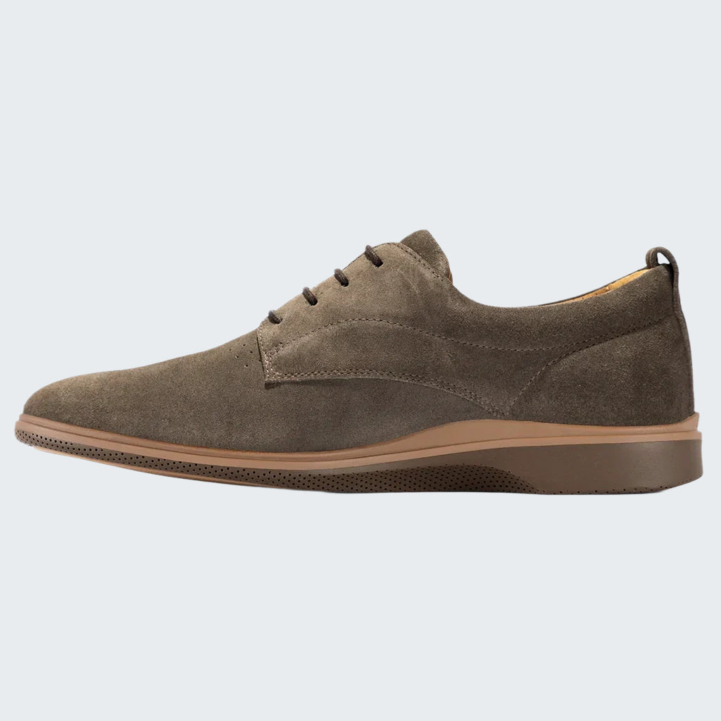 Brown suede shoe on a white background