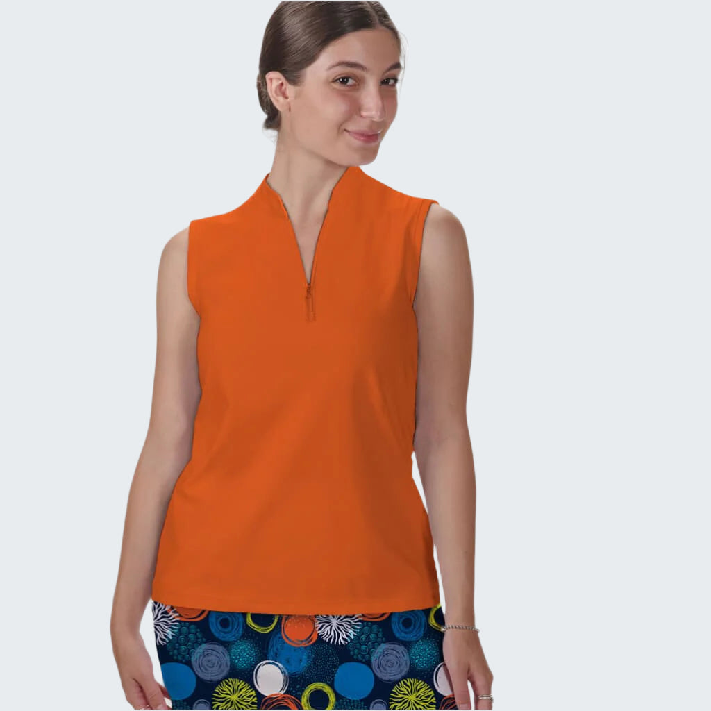 Woman wearing an orange sleeveless top with a white background