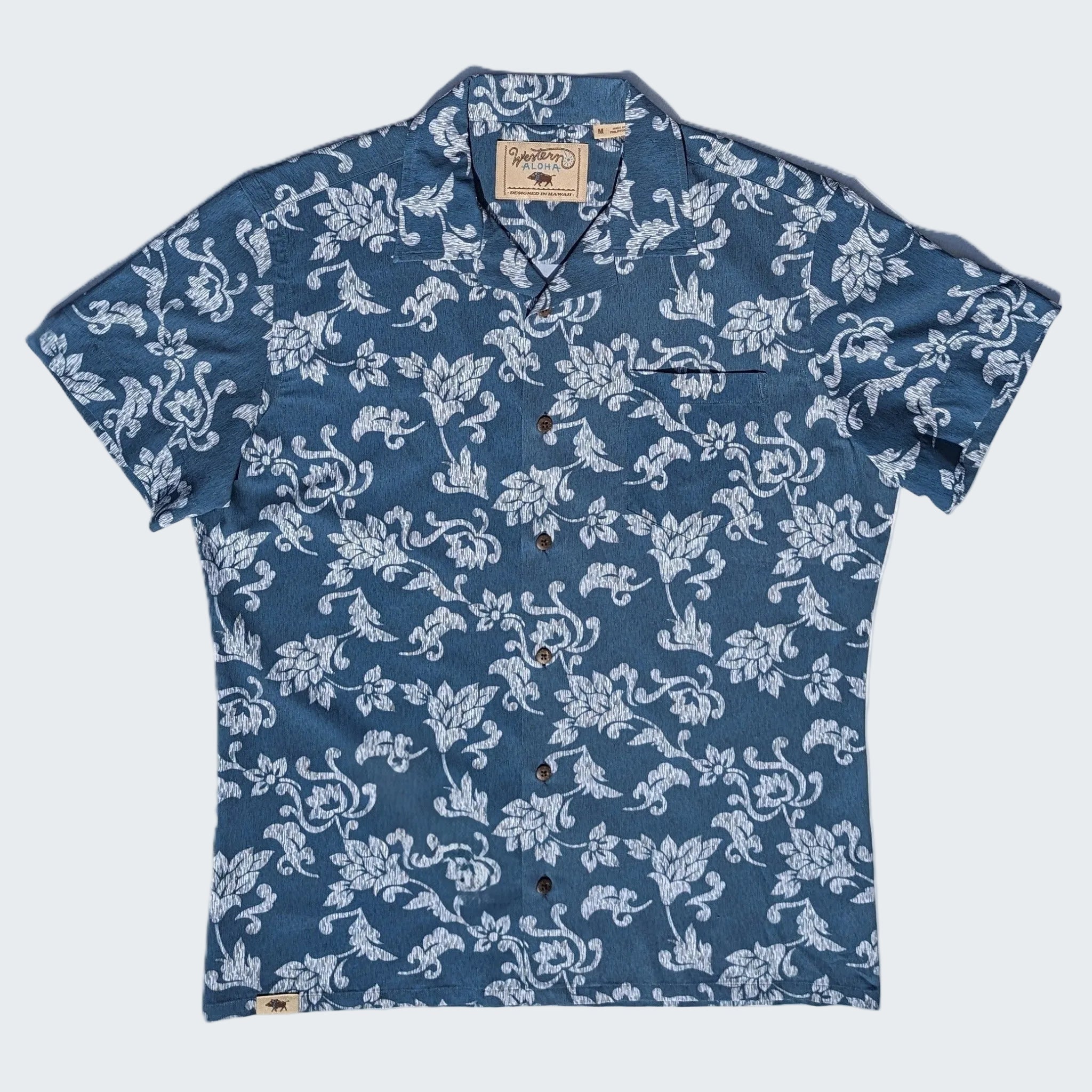 Blue floral patterned shirt on a white background