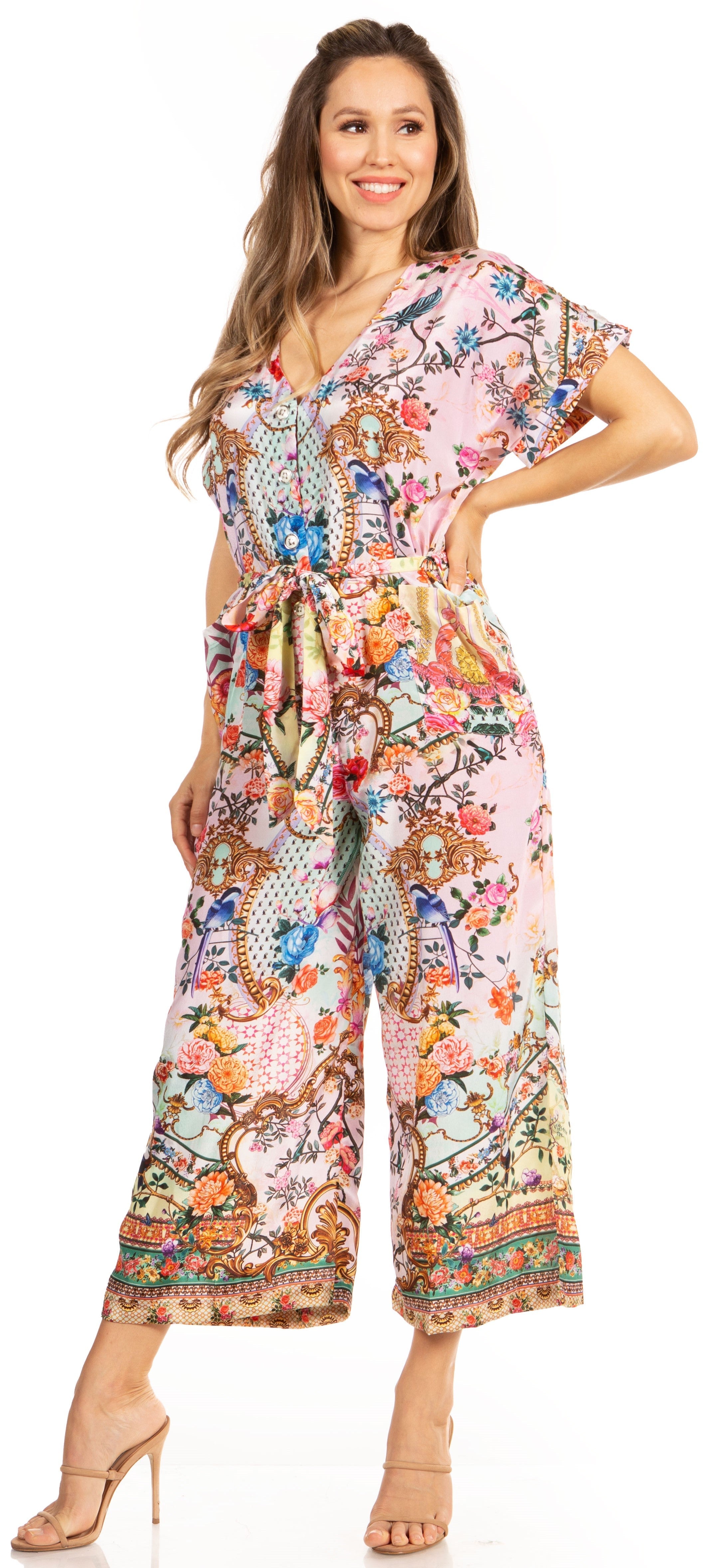 Woman wearing a colorful floral jumpsuit on a white background