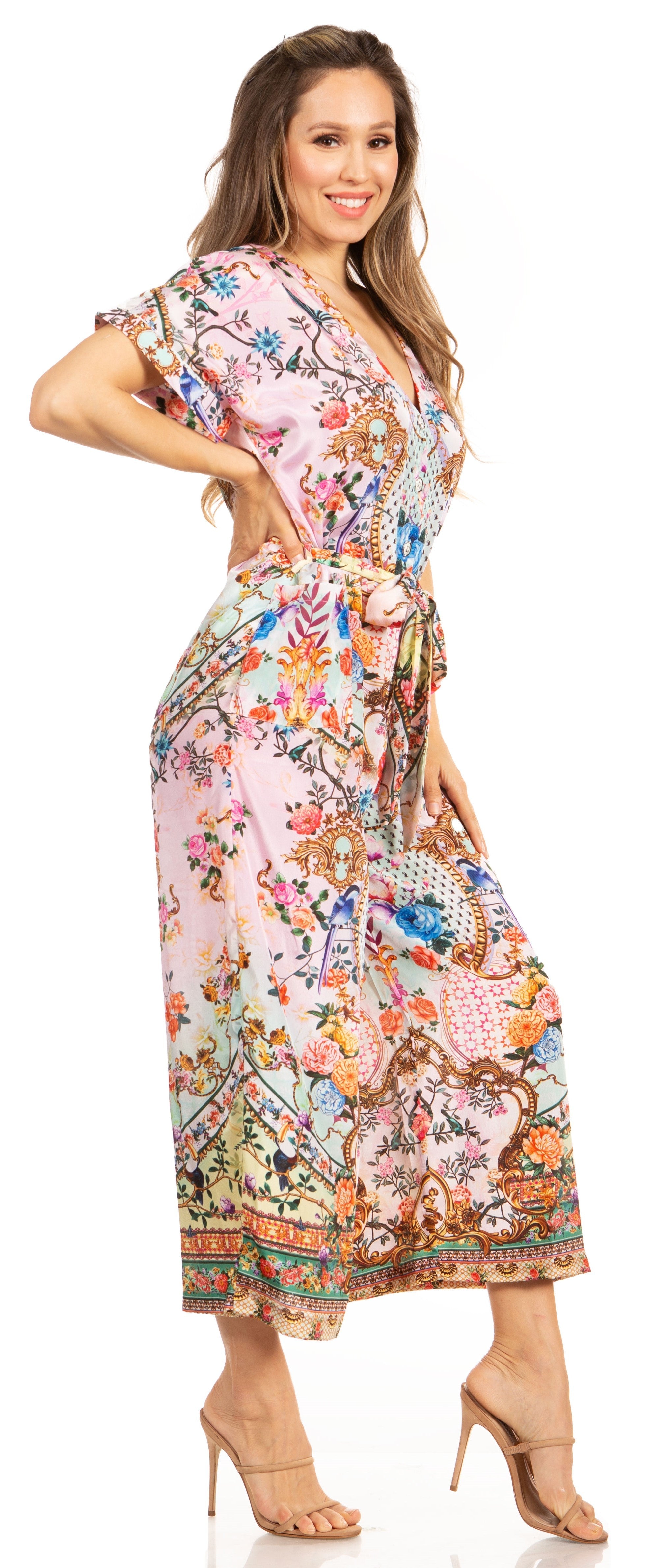 Woman wearing a colorful floral dress on a white background
