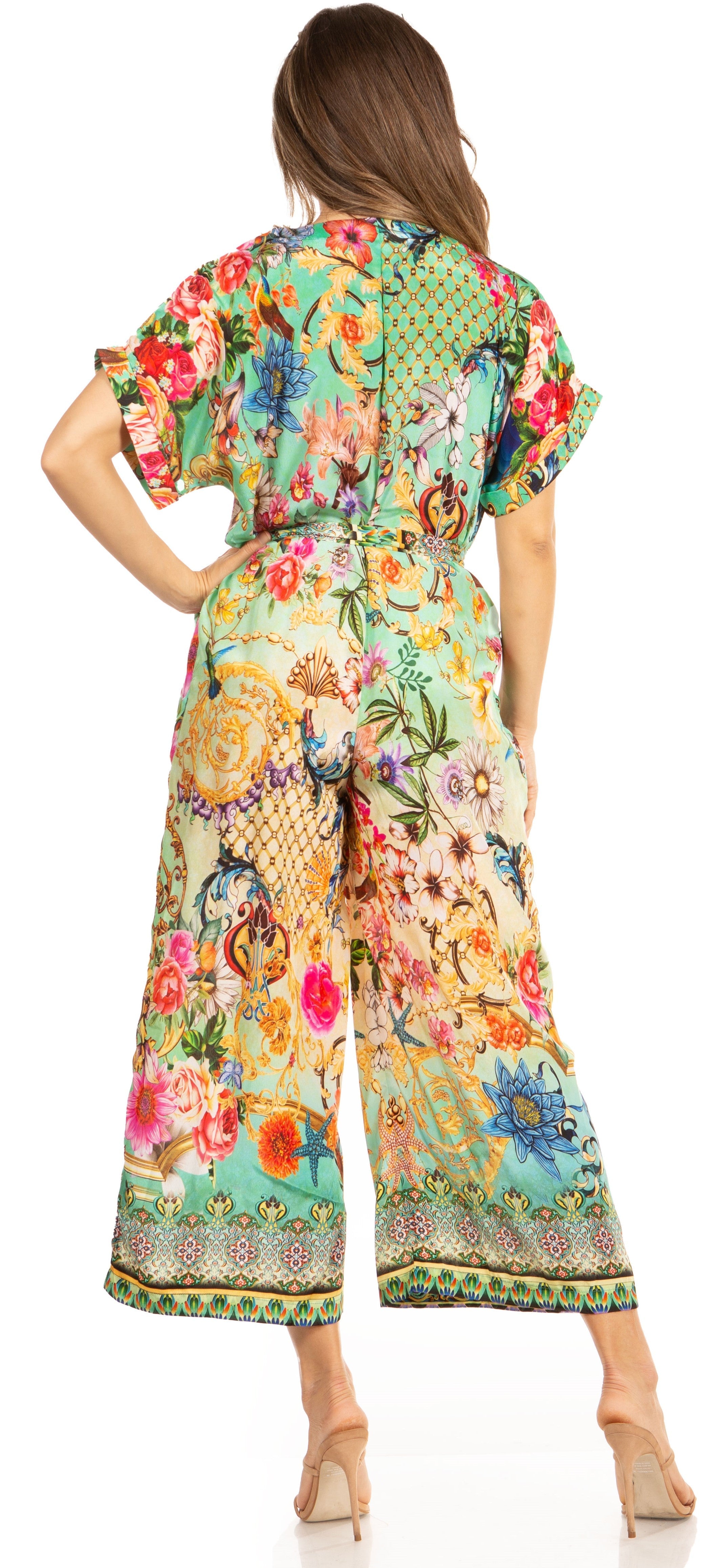 Woman wearing a colorful floral dress on a white background