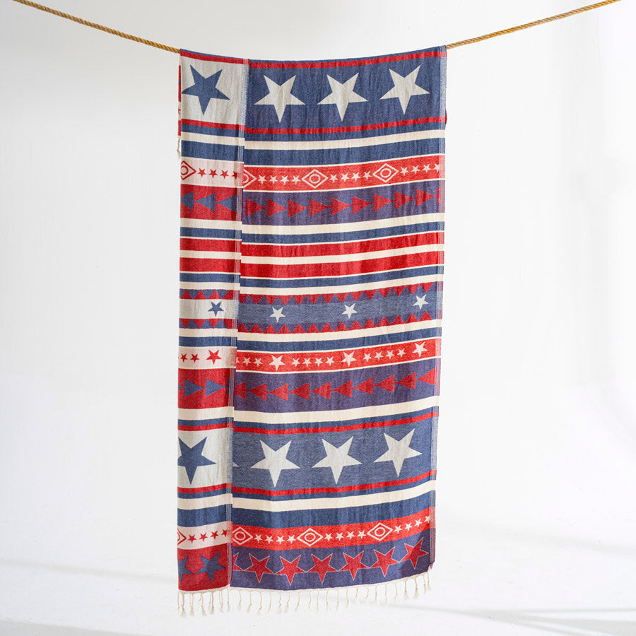 Decorative blanket with red, white, and blue pattern on a white background