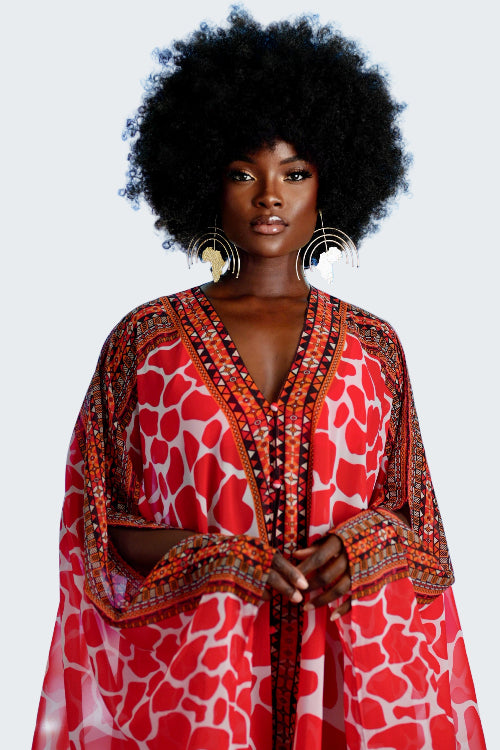 Woman wearing a red patterned dress with a blue background