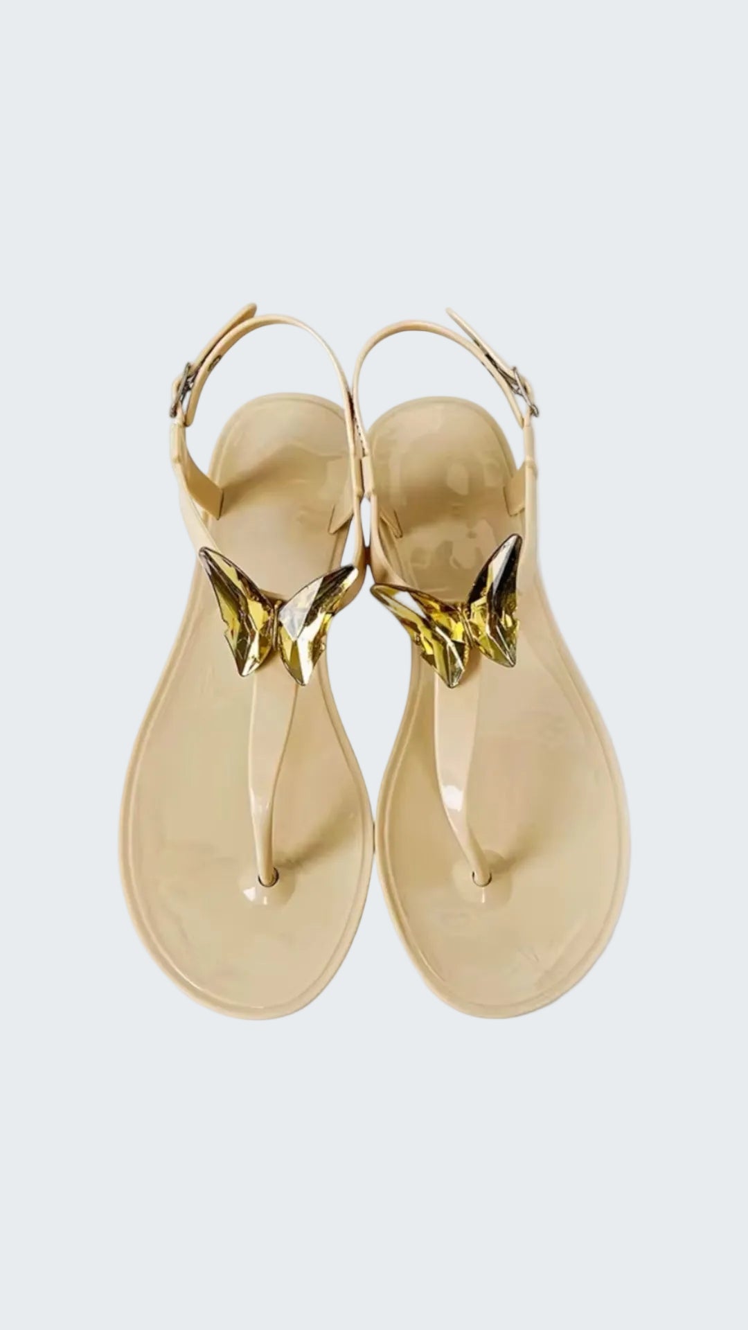 Gold sandals with a white background