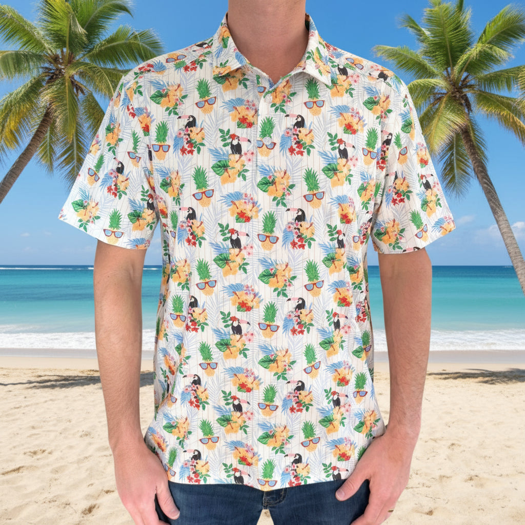 Person wearing a colorful tropical patterned shirt with a close-up inset of the design.
