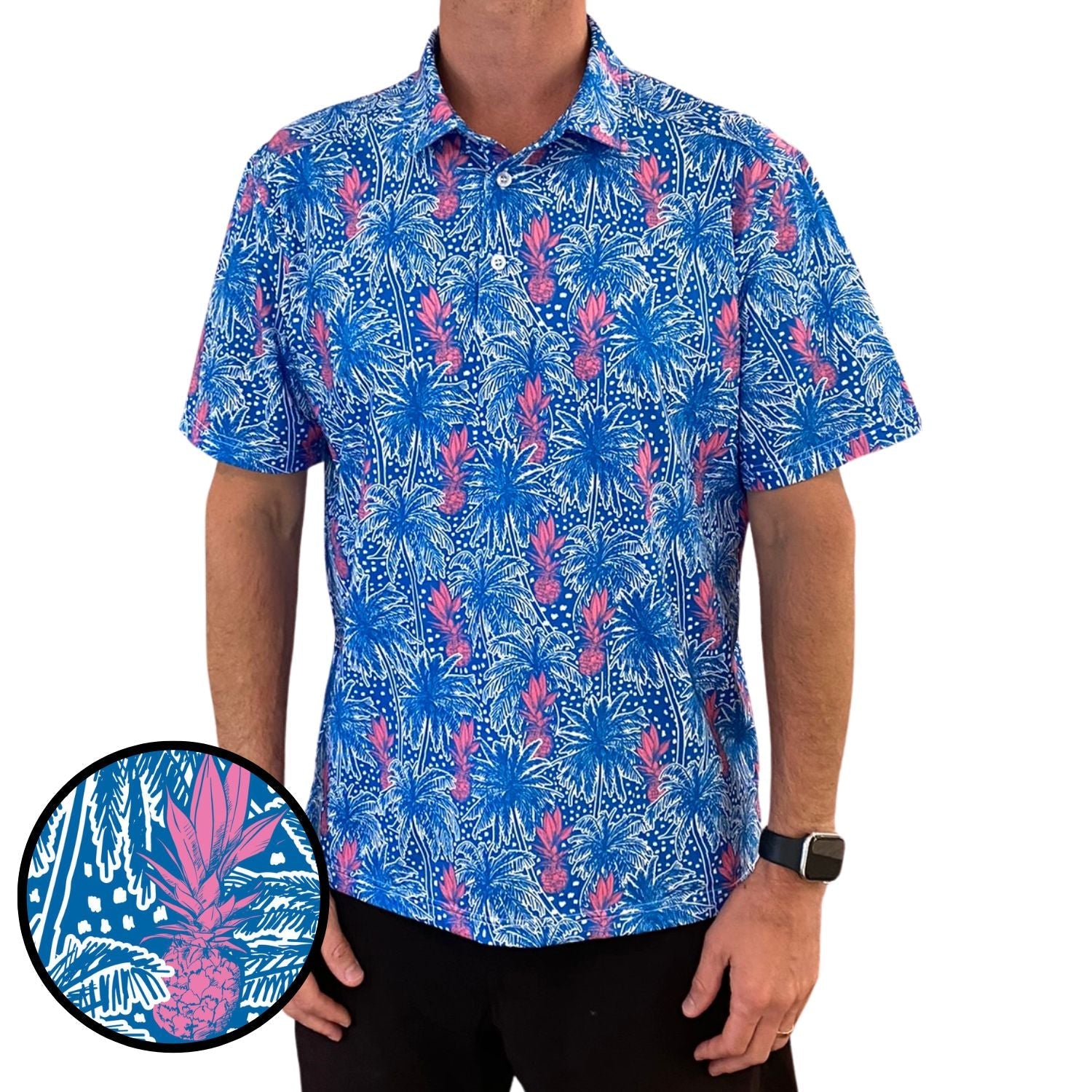 Person wearing a blue and pink floral patterned shirt with a close-up detail on a white background.