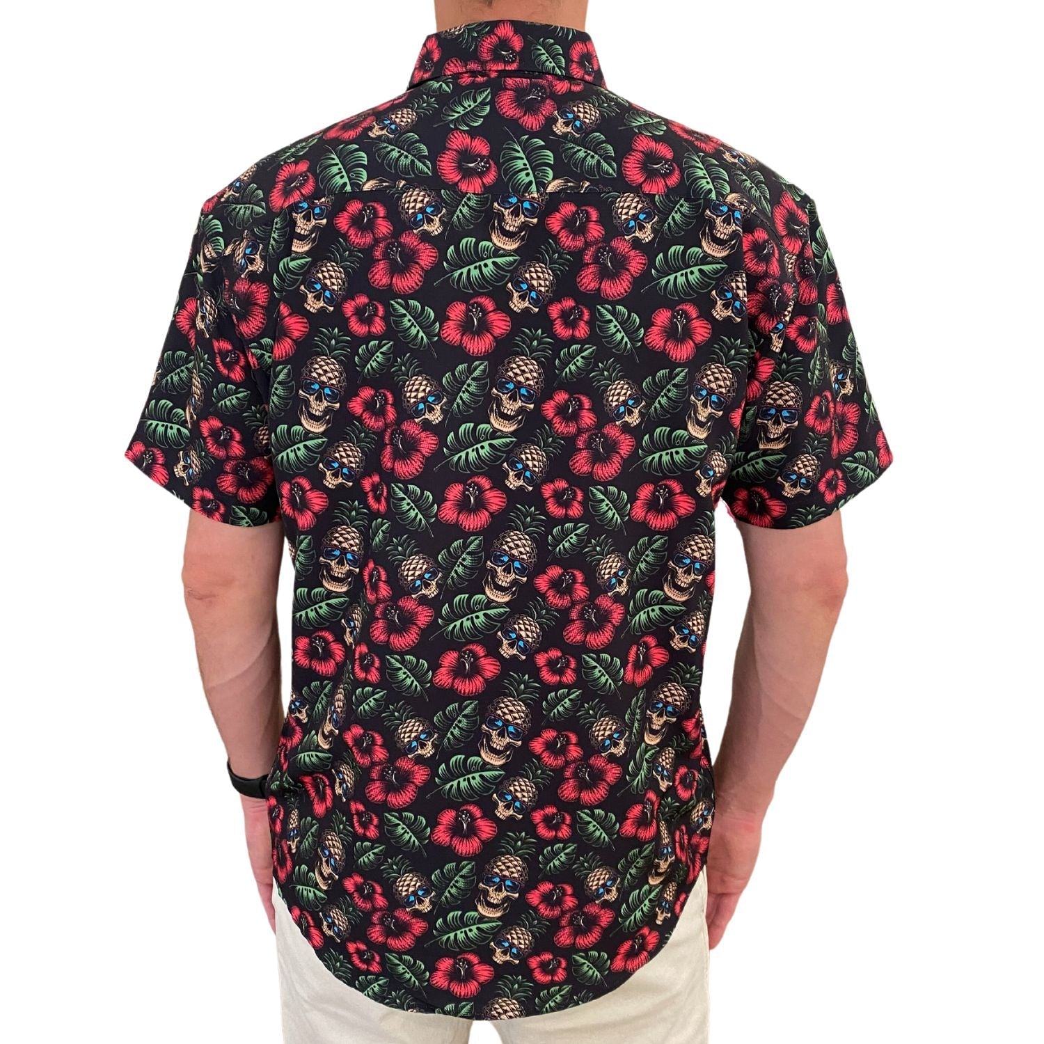 Short-sleeve shirt with tropical floral and skull pattern on a white background