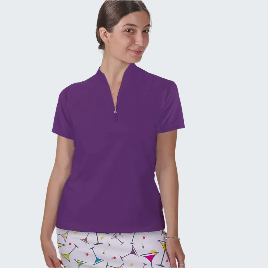 Woman wearing a purple polo shirt with a white background