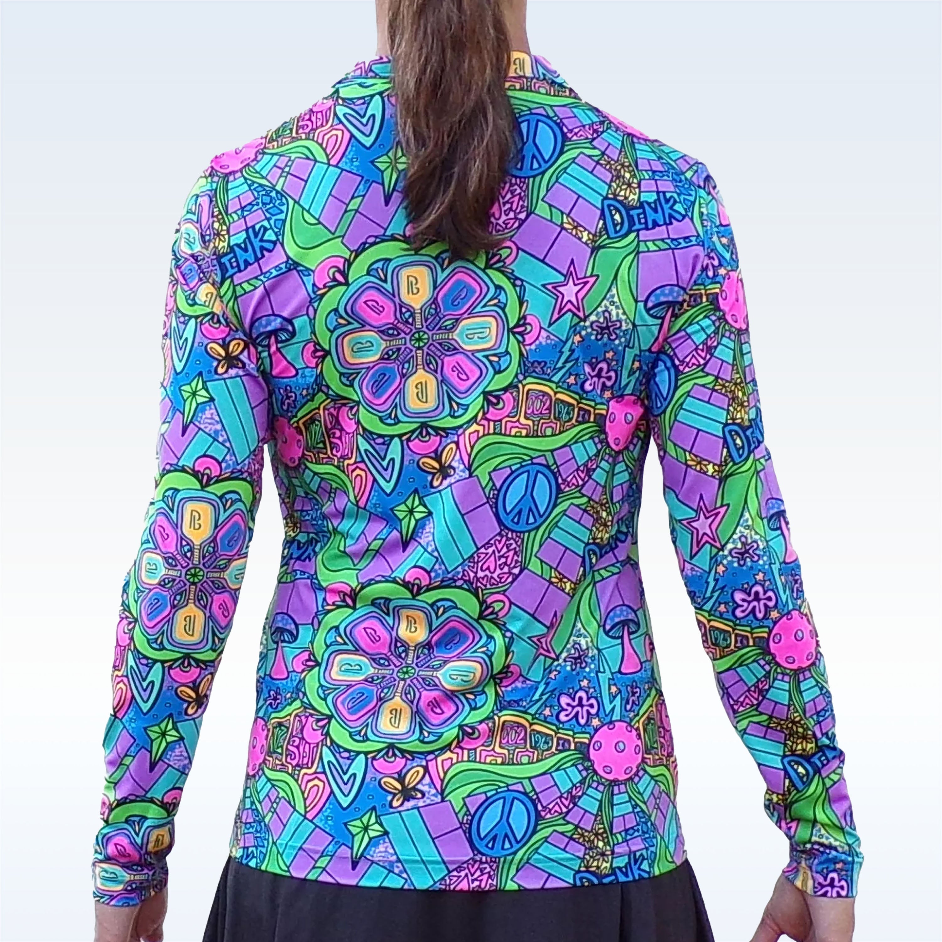 Colorful patterned shirt with flowers and peace signs on a white background