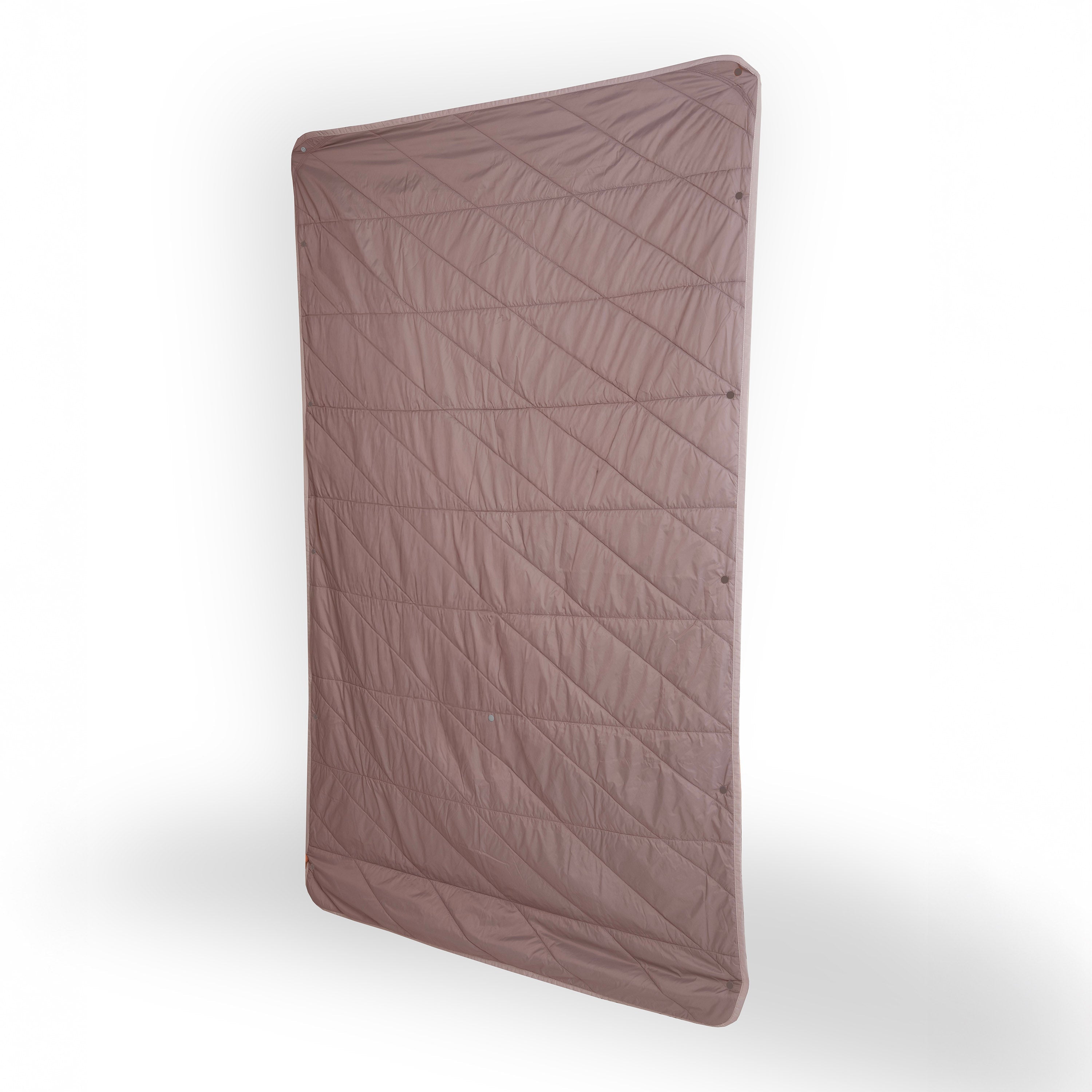 Brown quilted mat on a white background