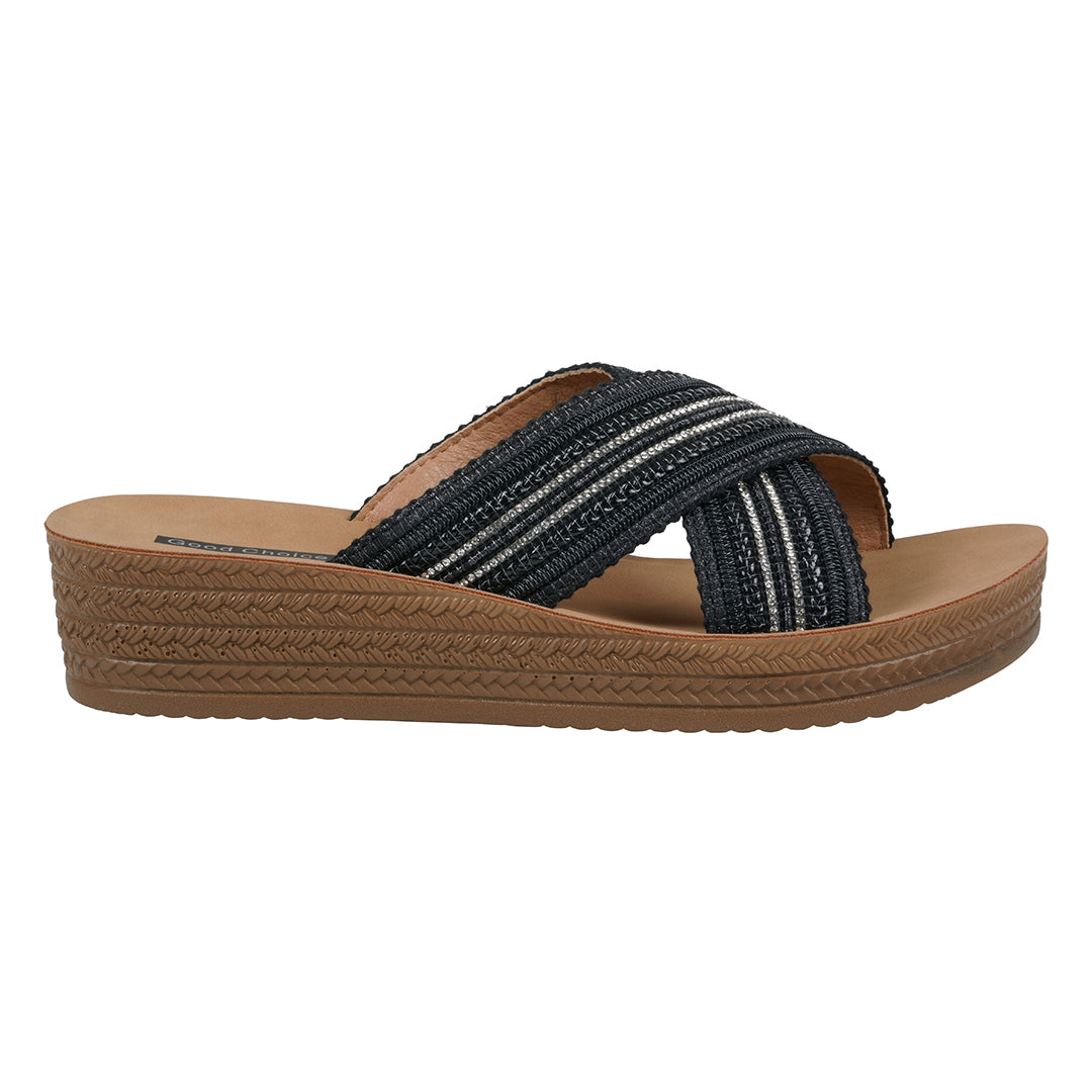 Black sandal with brown sole on a white background