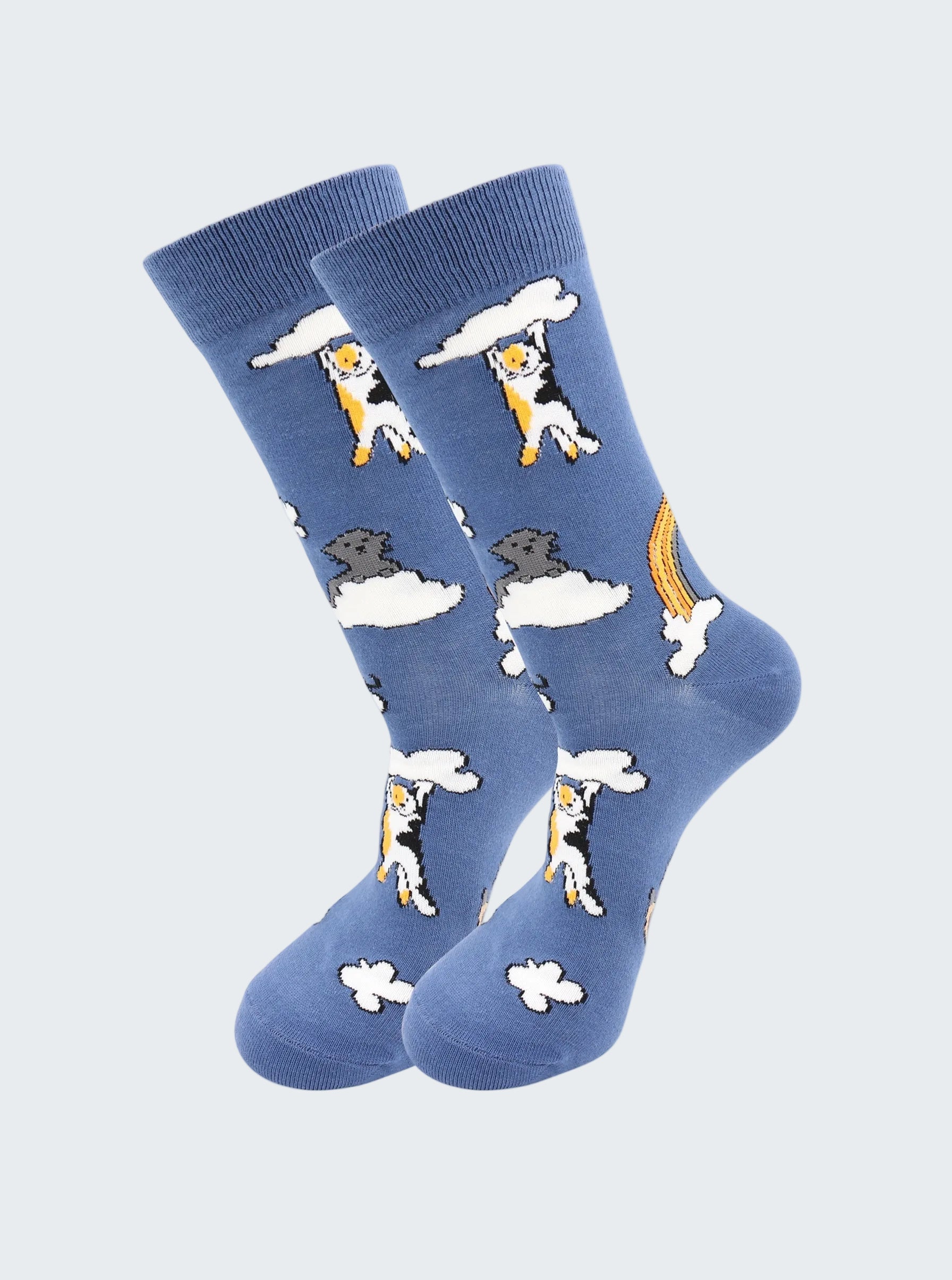Blue socks with dog and cloud design on a white background