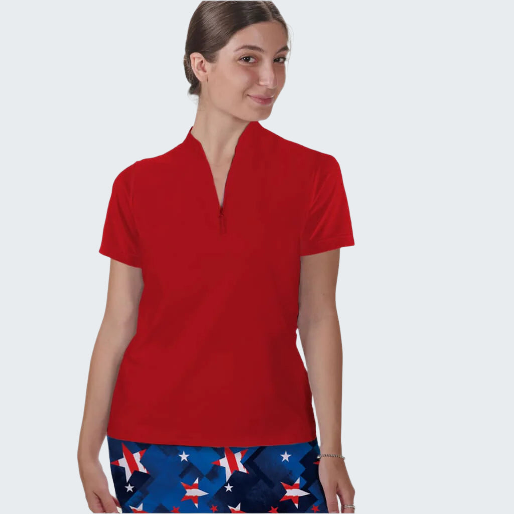 Woman wearing a red shirt and blue patterned pants with stars on a white background