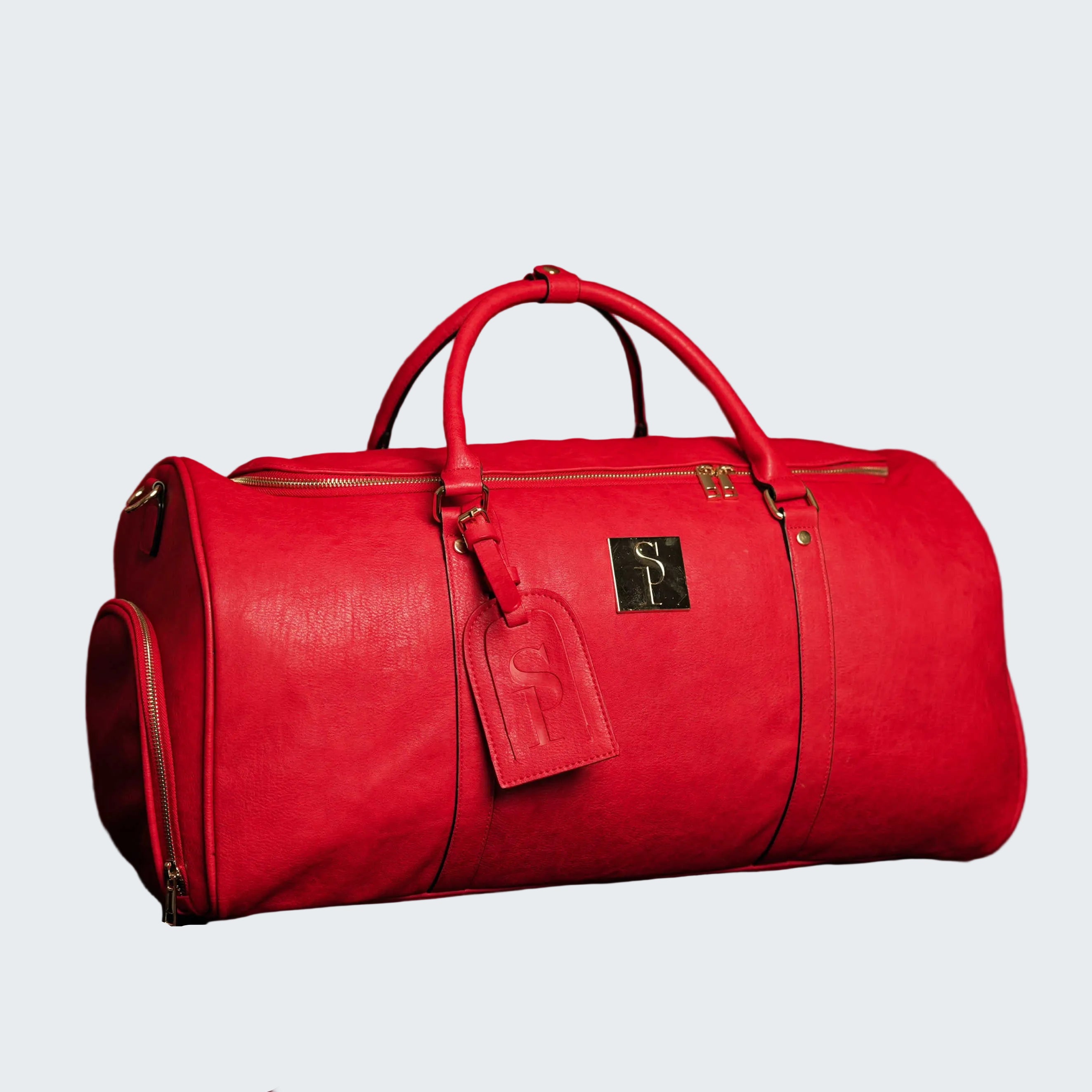 Red duffel bag with a visible brand logo on a red background