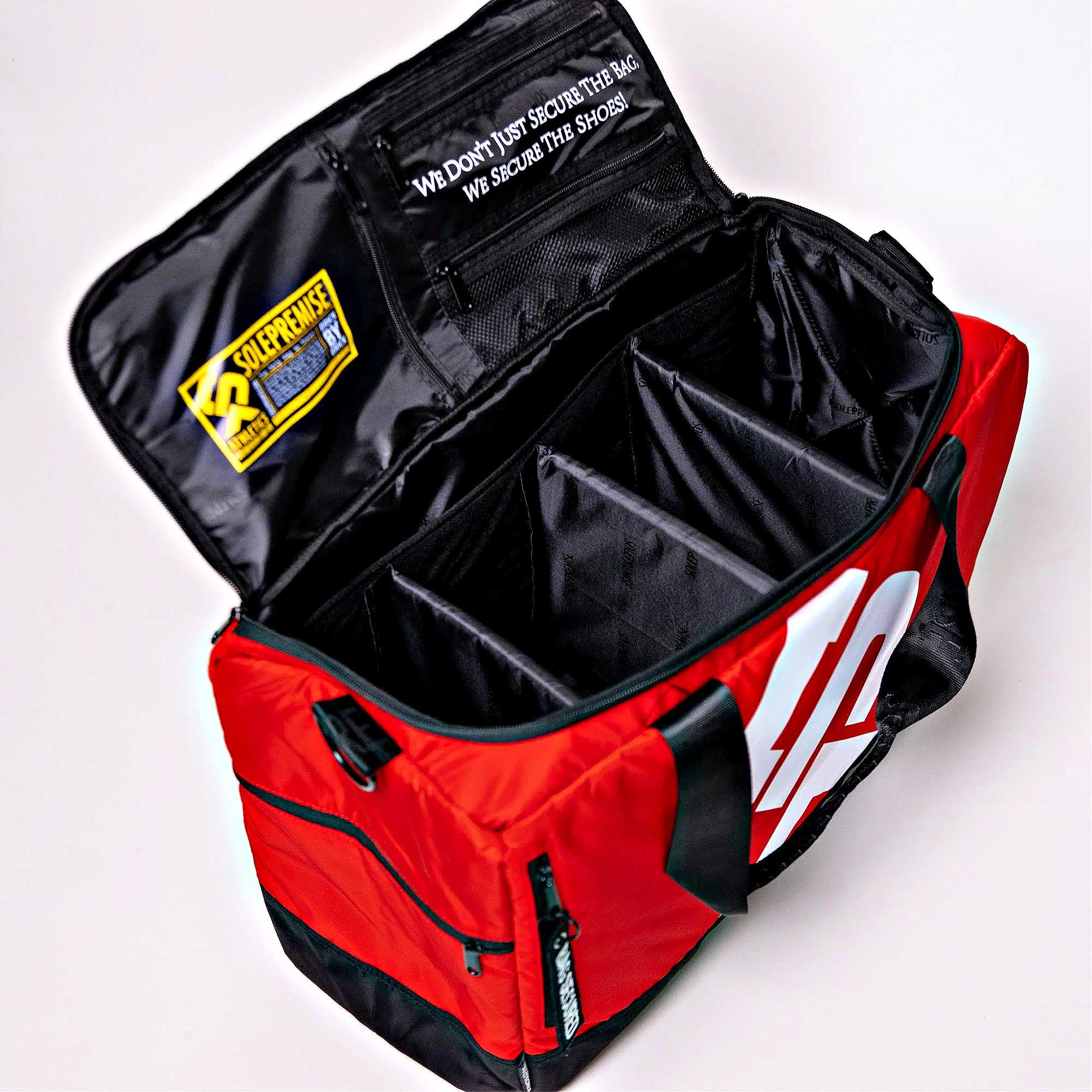 Red and black bag with visible branding on a white background