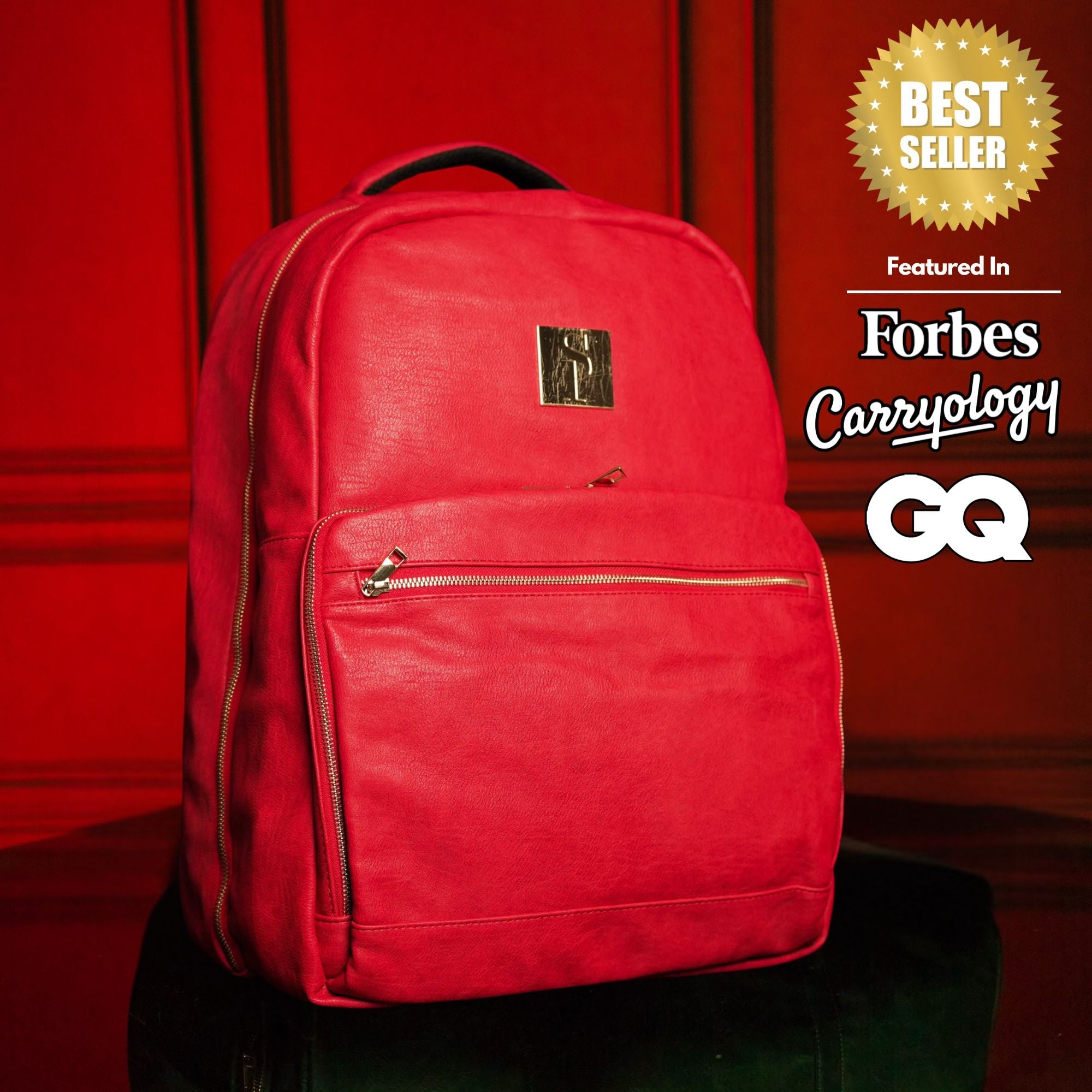 Red backpack with a brand logo on a red background, featuring 'Forbes Carryology' and 'GQ'.