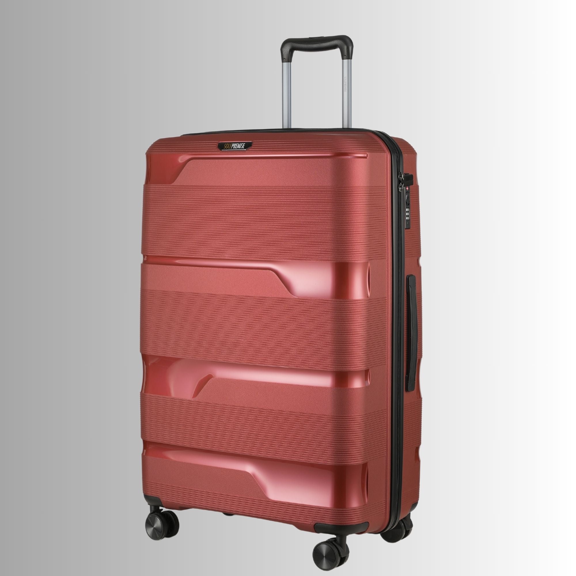 Red suitcase with a textured surface on a light gray background