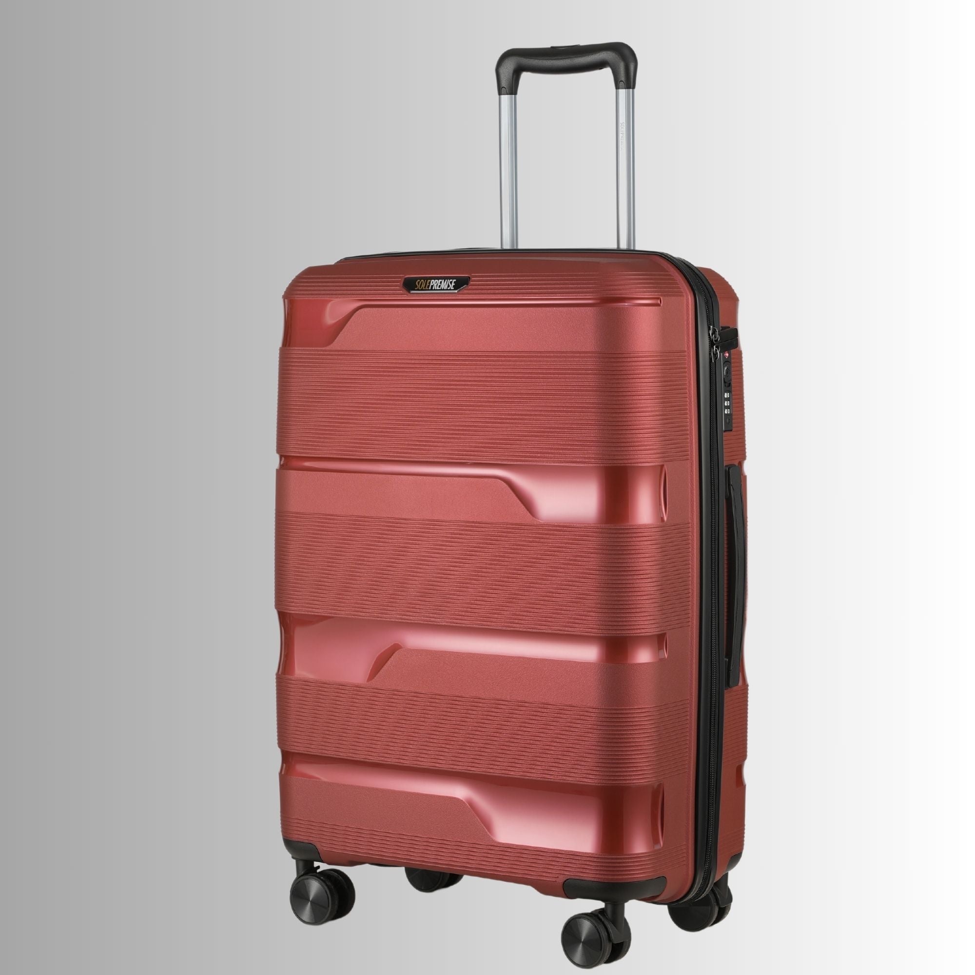 Red suitcase with a black handle on a light gray background