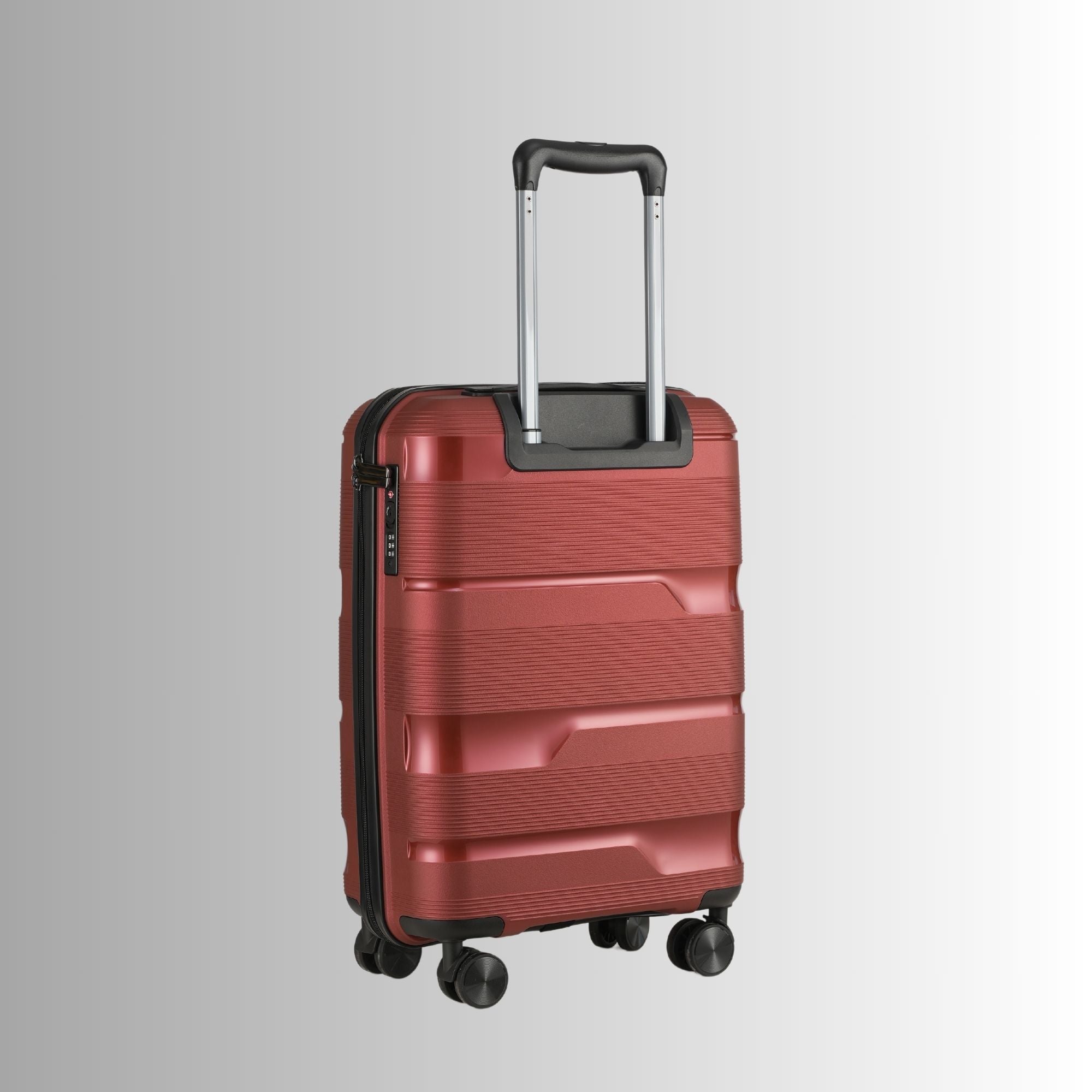 Red suitcase with a black handle on a light gray background