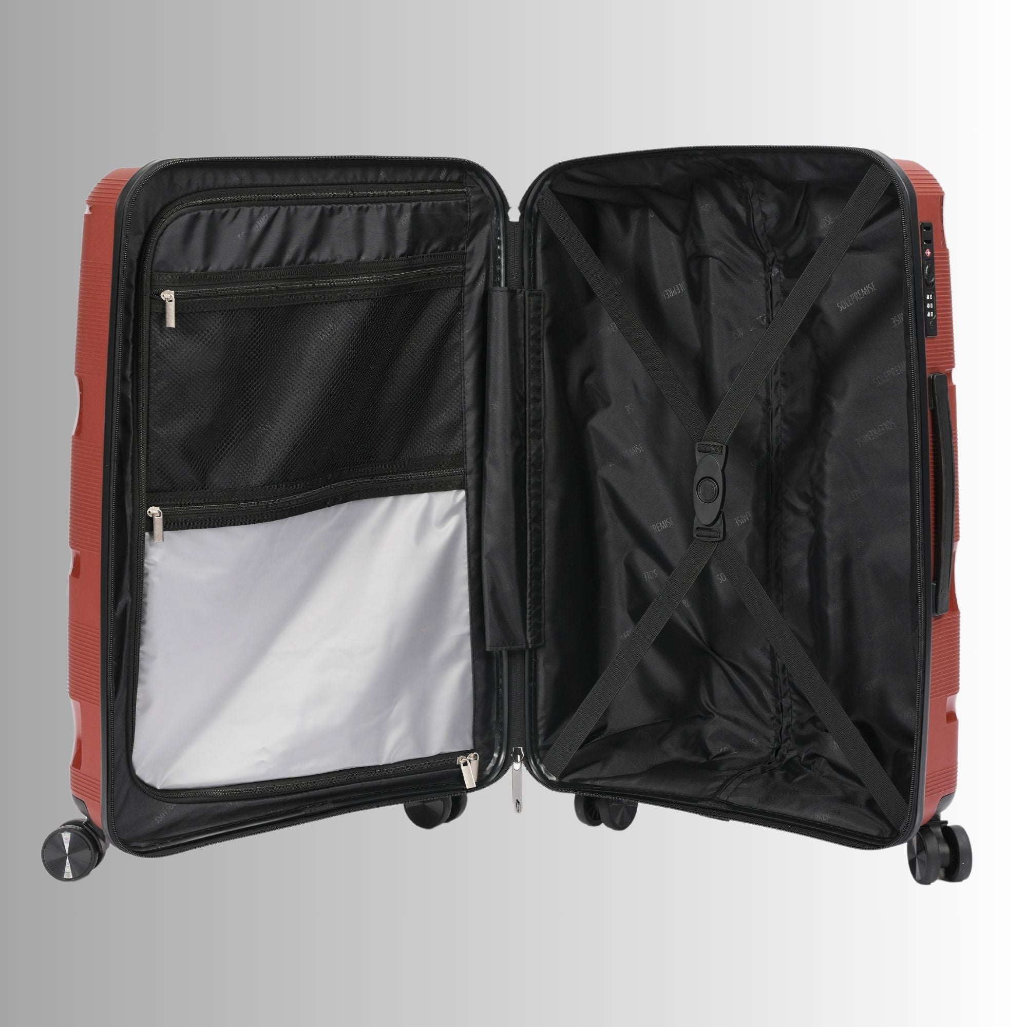 Open red suitcase with black interior on a light gray background