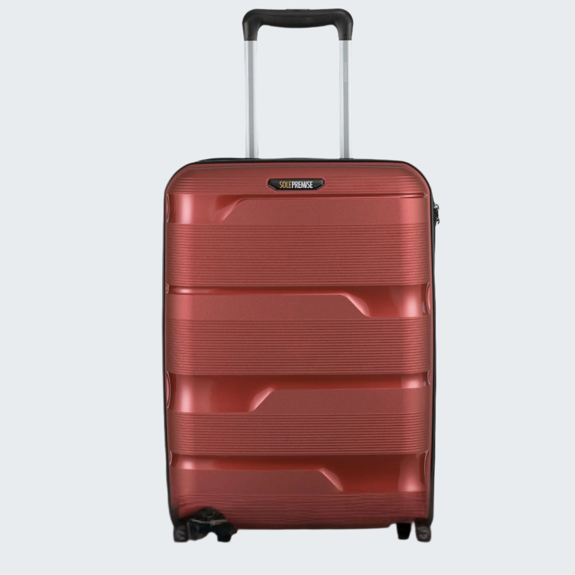 Red suitcase with a black handle on a light gray background