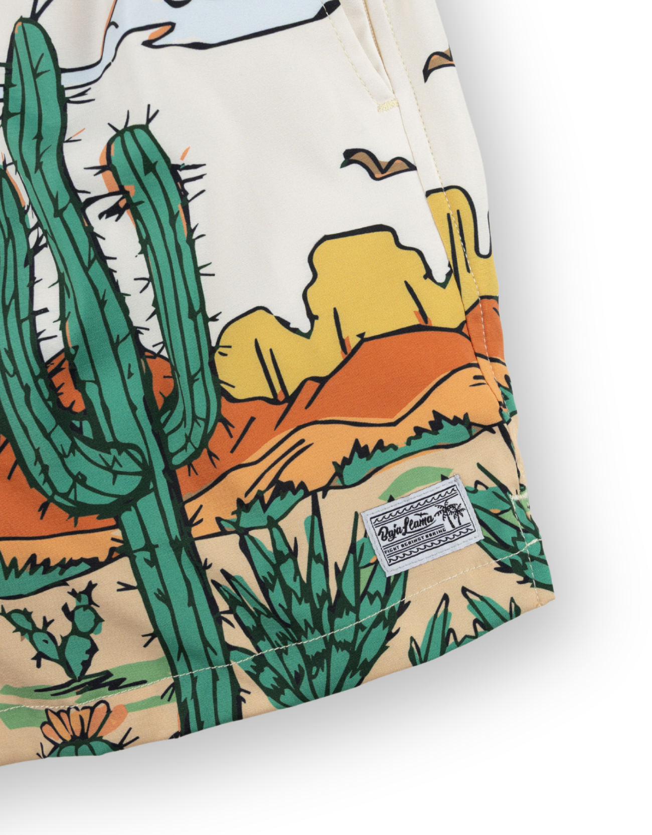 Product with desert-themed design featuring cacti and mountains, branded with a logo.