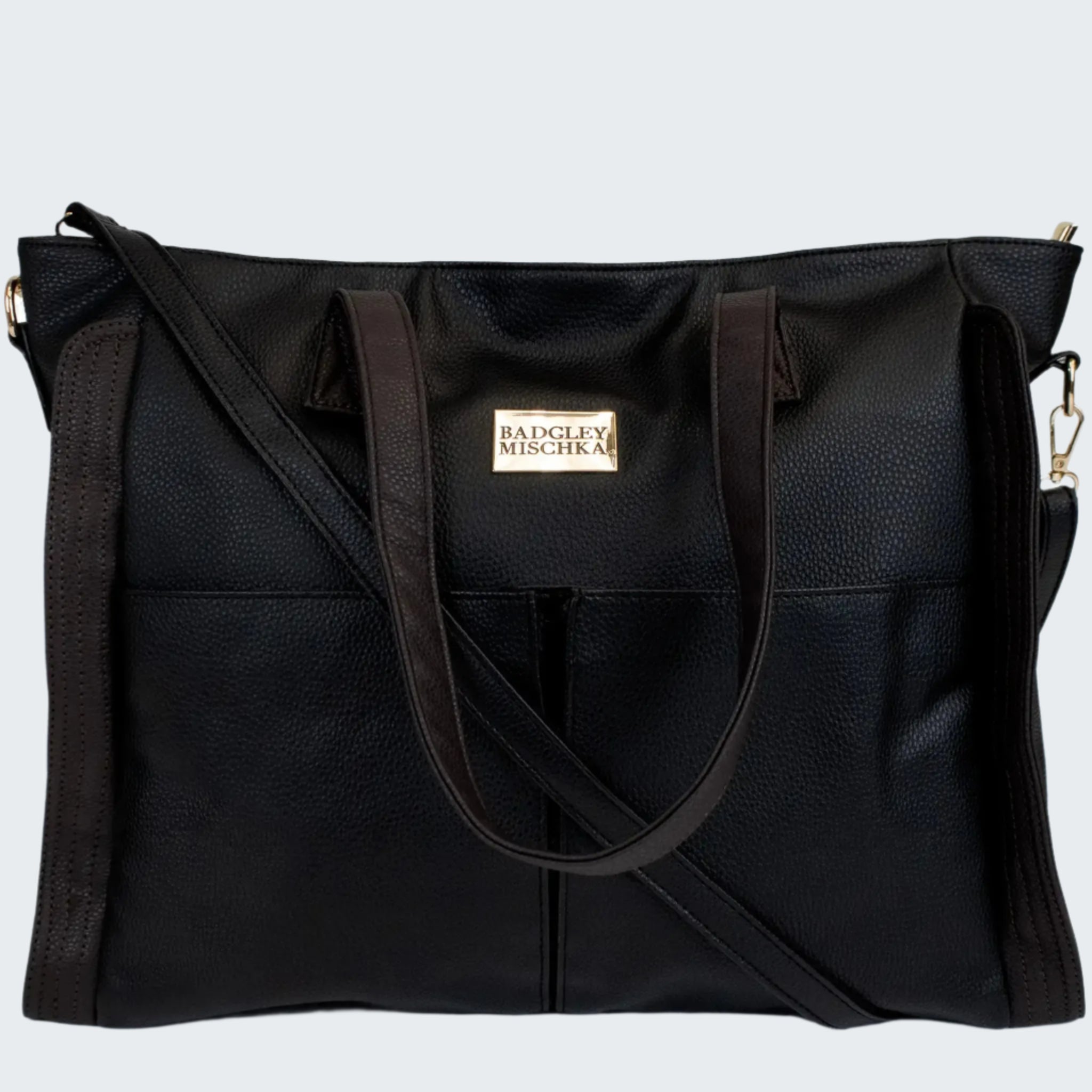 Black handbag with a visible brand label on a white background
