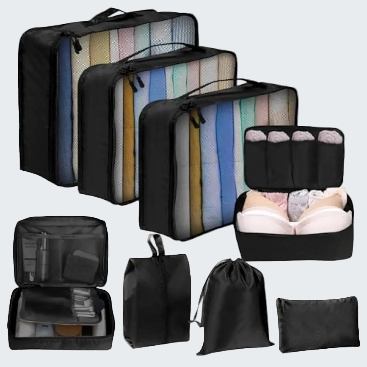 Set of black packing cubes and bags with various compartments on a white background