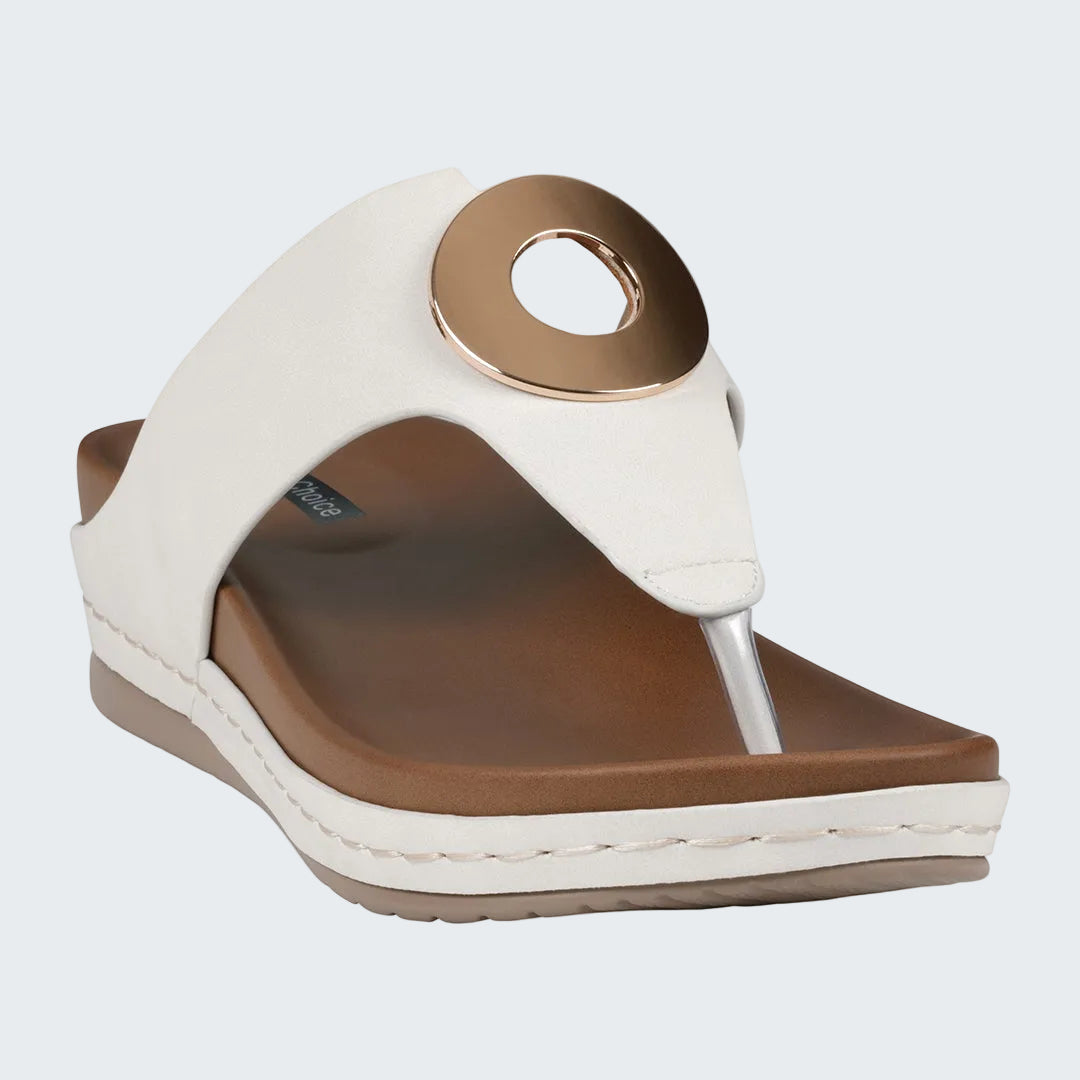 White and brown sandal with a unique design on a white background