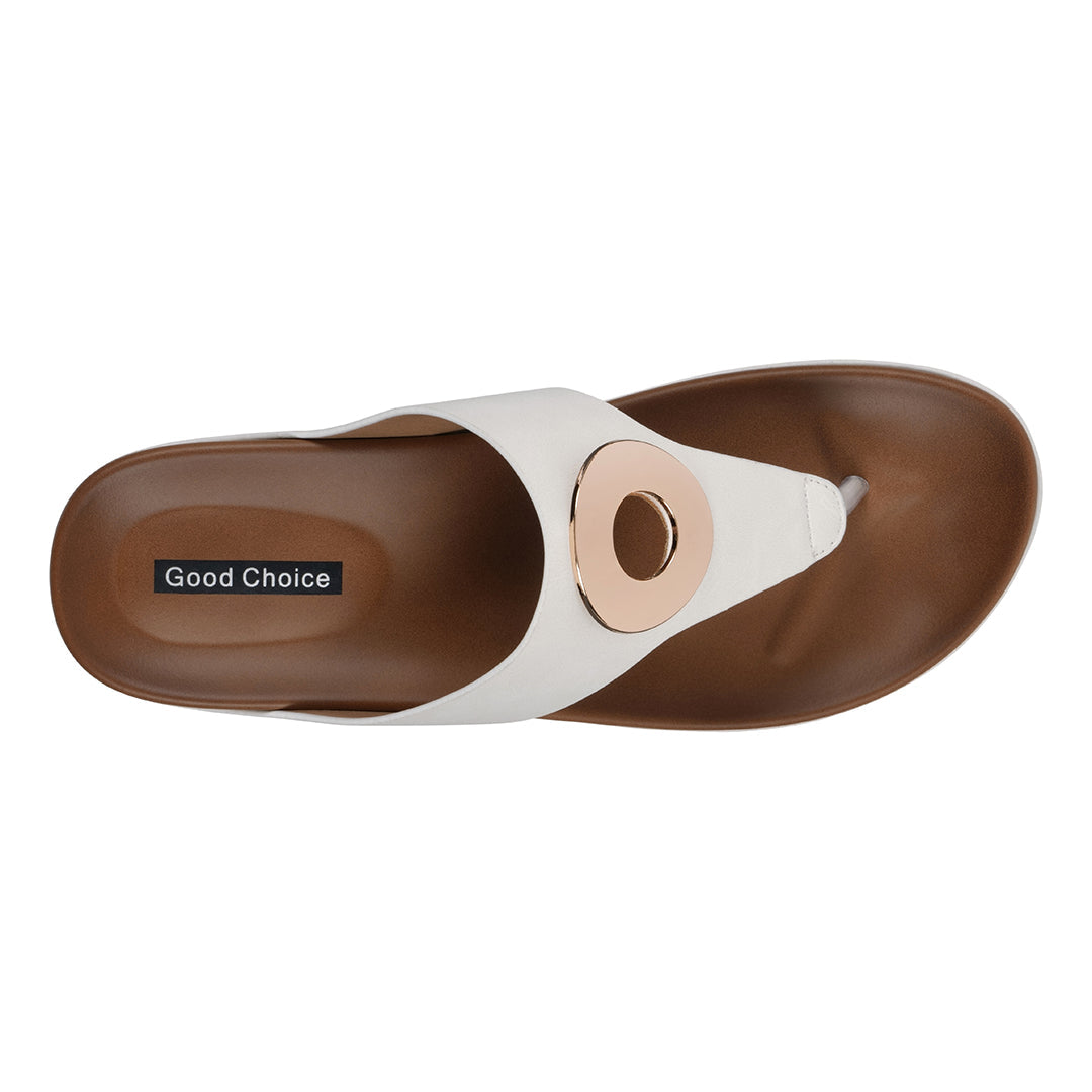 White sandal with brown sole on a white background