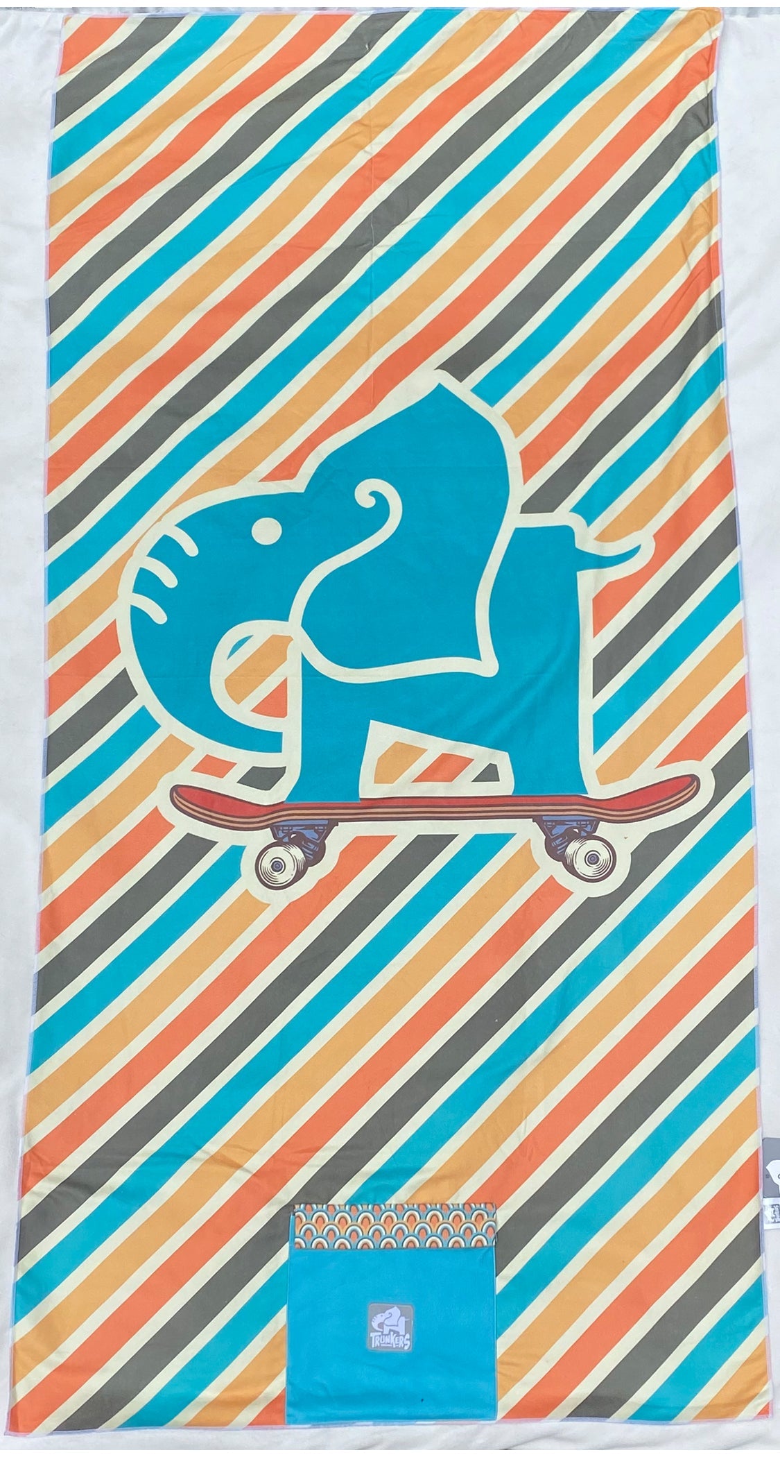 Teal elephant on a skateboard with diagonal striped pattern