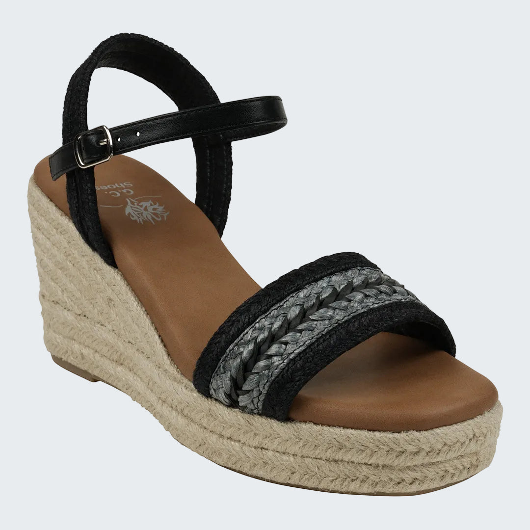 Black wedge sandal with braided design on a white background