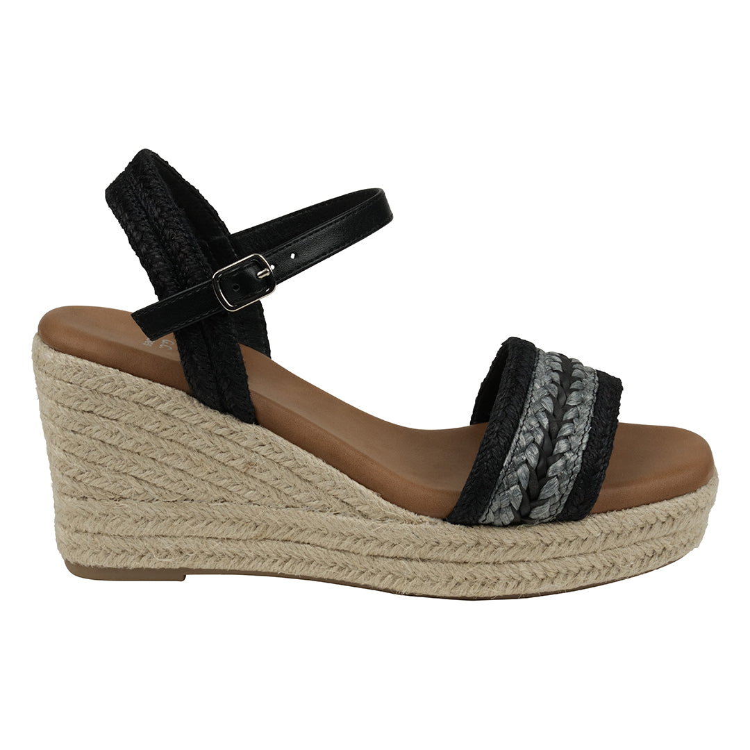 Black wedge sandal with braided sole on a white background