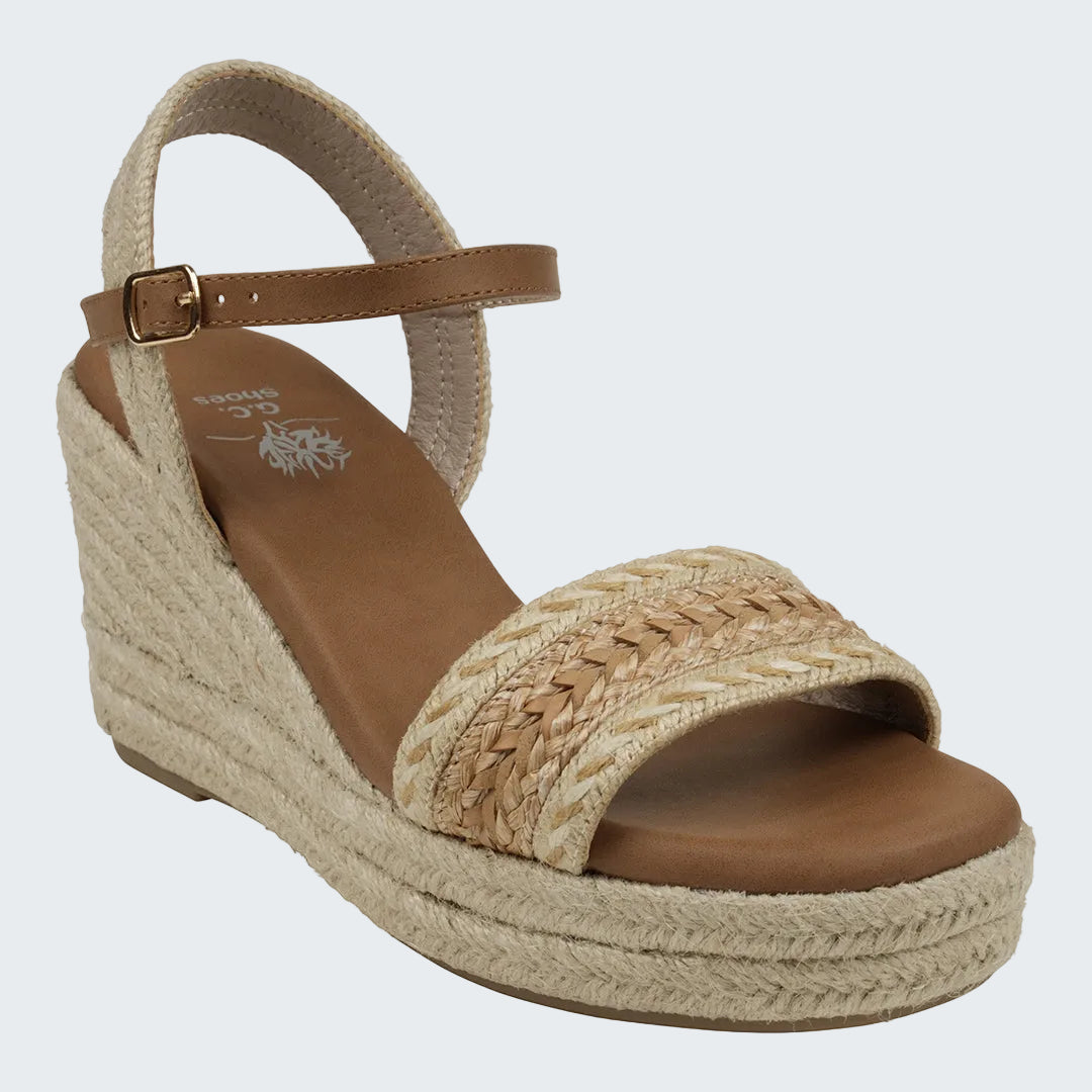 Beige wedge sandal with woven design on a white background