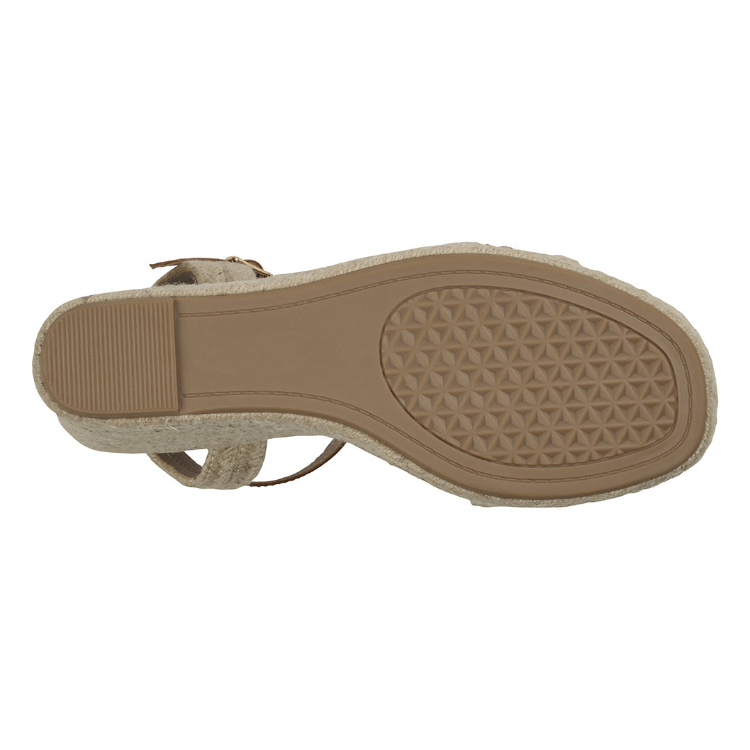 Tan sandal sole with textured pattern on a white background