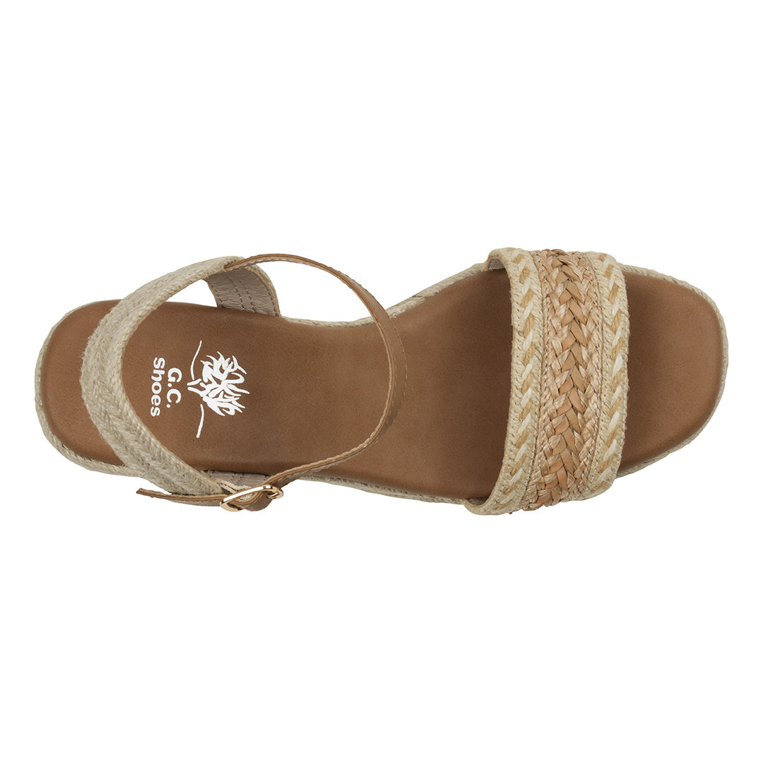 Brown sandal with woven straps on a white background
